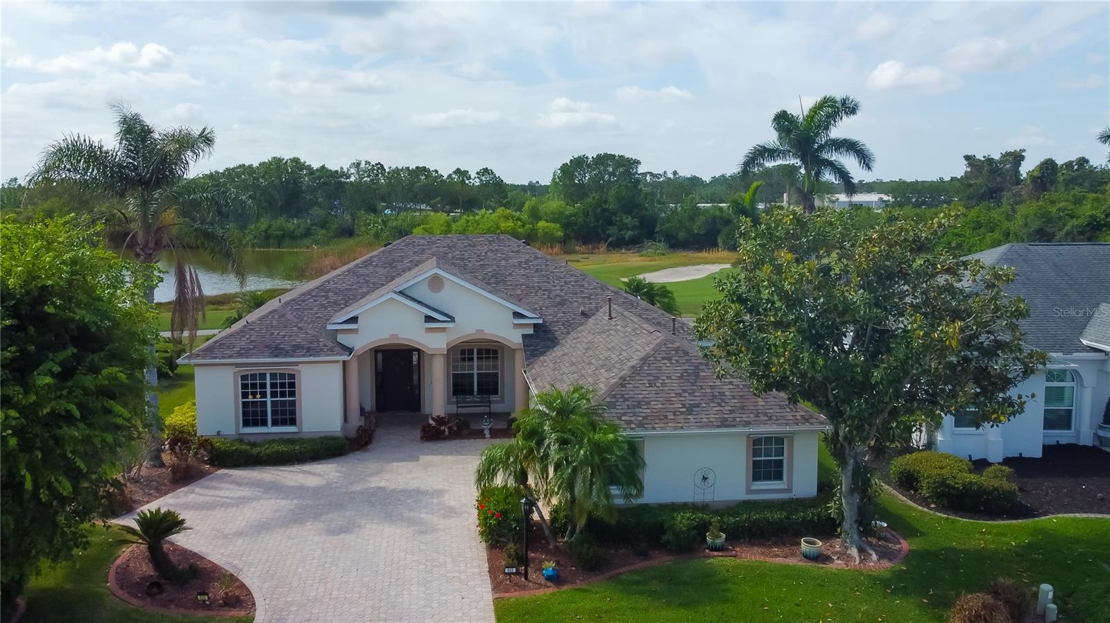 Value Just Got Better—Come Take Another Look! This elegant 3-bedroom, 2.5-bathroom home, complete with a den, 3-car garage, and a heated pool and spa—all perfectly situated on the scenic Greenfield Golf Course. Non flood-zone for peace of mind.
From the moment you step through the inviting entryway into the spacious living area, you’ll feel right at home. The thoughtfully designed kitchen balances functionality with style, boasting granite countertops, hardwood cabinetry, a vegetable sink on the island, and ample storage with convenient pull-out drawers. Two generously sized pantries, also equipped with pull-out drawers, ensure effortless organization. Plus, the home features a central vacuum system, making everyday cleaning easier and more efficient.
Adjacent to the kitchen is a charming dining nook that flows seamlessly into the comfortable gathering room—ideal for quality time with family and friends.
The thoughtfully designed split floor plan offers privacy, with the primary suite boasting his-and-hers walk-in closets. Every room is bathed in natural light, creating a warm and welcoming ambiance throughout the home.
Start your mornings or unwind in the evenings on the lanai, which overlooks the sparkling pool and the picturesque 6th hole of the golf course.
This home is packed with valuable updates and extras: a roof (2022) with a transferable warranty, a 200-amp electric panel (2020), an updated HVAC system (2020) with an additional return air vent in the primary bedroom, gas ready stove, hurricane shutters, a 5-panel solar heater for the pool, beautifully maintained landscaping, and a third garage bay for extra storage.
Located with convenience in mind, this property offers easy access Interstate 75 (I-75), State Road 64 (SR-64),Sarasota-Bradenton International Airport and still offers quick access to shopping, dining, and coastal attractions.
We warmly welcome you to explore this exceptional home and envision the lifestyle it offers.