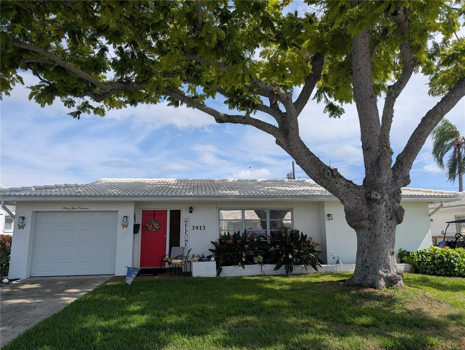 Location, location, location…Great opportunity to purchase a slice of tropical paradise. A one-of-a-kind, WATER VIEW home located in an awesome +55 GOLF community. From exterior to interior, this home exemplifies "pride of ownership." This well-maintained 2BR/2BA Fairfax model offers the popular SPLIT floorplan design, a large master suite, an over-sized Master Bath with walk-in closet, a separate eating room or bonus area in addition to a breakfast bar opening into a spacious L-shaped Florida room. (Current heated living space is 1,310 expandable to 1,710 sq ft if you choose to install heating and air conditioning in the Florida Room…so much more additional potential to customize). The kitchen is the "Heart of the Home" surrounded by the Living, Dining, Bonus & Florida rooms. The galley kitchen offers a pass thru window to the breakfast bar for casual dining convenience, newer stainless-steel appliances including an LG refrigerator w/ice maker (2022), Whirlpool glass top range w/microwave hood (2025), Frigidaire dishwasher (2022) and disposal. Other kitchen features include tile flooring, stainless steel sink, white cabinetry and hall closet pantry. Interior updates include new Luxury Vinyl flooring (2025) in living area, updated lighting/ceiling fans and a 75" Sony TV which does stay. Dining room sparkles with a unique hanging light. Florida room features a wall of windows that provide great natural light/airflow and spectacular water view. The back patio is directly accessed from the Florida room...a great outdoor space to relax. The Master bedroom, directly off the dining room, offers carpeting, ceiling fan/light and the private ensuite bath with walk in shower. Carpeted guest bedroom and guest bathroom are located off the Bonus area. Cutler Hammer electric panel located in guest bedroom closet. Guest bath has bathtub w/shower and linen closet in hall. Oversized one car garage features laundry area with new front load LG washer/dryer (2023), Amarr impact rated garage door, Linear door motor, State water heater (2021), pull down attic access, extra storage and Carrier HVAC system (2021). Exterior features include nicely manicured landscaping, tile/flat roof (2021), gutters/downspout and irrigation system. Home is protected by a Google Nest Security System. Monthly maintenance fee of $497.00 includes lawn care/irrigation maintenance, exterior painting, roof repair/replacement, water/sewer/trash, internet/cable in addition to maintaining all community property (clubhouse, pool, roads, sidewalks, lakes)! Two pets, any size welcomed. Come join the very active 55+ Unit 3 in the Mainlands of Tamarac community with spacious clubhouse, heated in-ground pool, shuffleboard courts, access to Mainlands public golf course and a variety of activities! Centrally located in the Heart of Tampa Bay, between St. Petersburg, Clearwater & Tampa, the great Florida lifestyle is at your fingertips. Endless activity choices from Bay to Gulf. Additional conveniences include lots of nearby shopping, sporting/cultural venues, excellent medical/emergency care facilities, restaurants, banking, churches as well as easy access to Gulf coast beaches, US-19, I-275 & two airports.