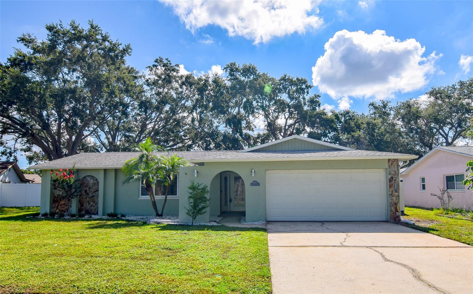 FABULOUS 3BR/2BA BLOCK HOME IN BOCA CIEGA RIDGE! This beautifully maintained Seminole home offers block construction, stunning curb appeal, and a warm, welcoming front entrance. Inside, you'll love the spacious split-bedroom layout featuring a formal living/dining room and a separate family room with sliding glass doors leading to the large screened lanai—ideal for relaxing or entertaining. The updated kitchen boasts wood cabinetry, solid surface countertops, stainless steel appliances, a stylish tile backsplash, and a breakfast bar. The adjacent dinette area includes built-in pantry cabinets for added storage. The primary suite features a barn-door entry, dual closets and a beautifully updated en-suite bath with a quartz-topped double vanity and a large walk-in shower. Two additional generously sized bedrooms—one with dual closets—share an updated guest bath with a tub/shower combo. Interior laundry room includes a utility sink and a second refrigerator. The oversized 2-car garage offers ample parking and storage space. Enjoy the outdoors on the large paver patio within the screened lanai, all in a fenced backyard for added privacy. Major updates include NEW HVAC (2017), Water Heater (2022), and Vinyl Privacy Fence (2020). Situated in a desirable NON-FLOOD ZONE near top-rated schools, shopping, dining, and just minutes from the Gulf beaches! Don't miss your chance—schedule your private showing today!