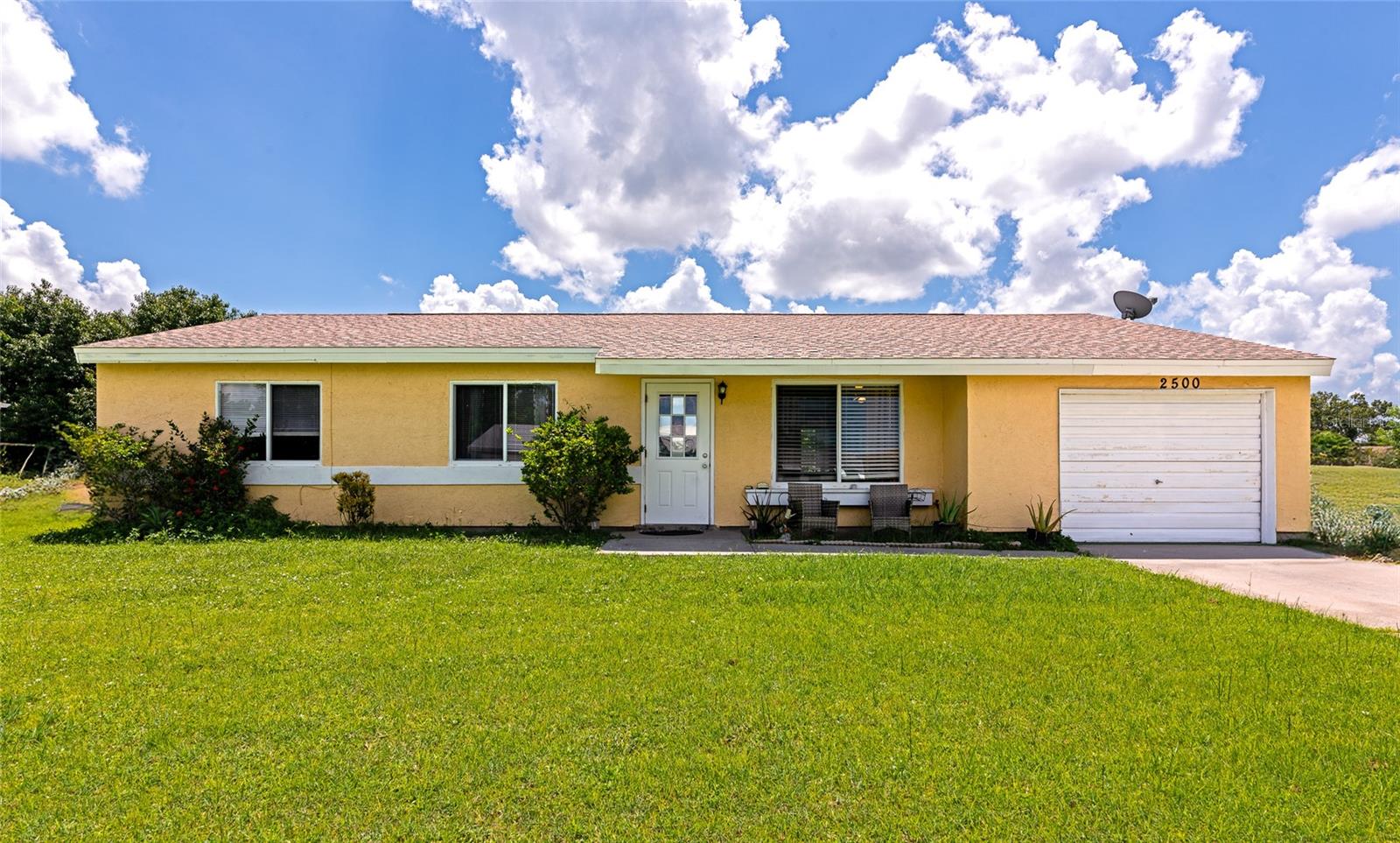 Welcome to 2500 Roxbury at Jockey Club. As soon you walk in you will feel the peaceful this house brings. The natural lights and practical layout makes you feel comfortable. Three spacious bedrooms, two updated bathrooms, wood flooring, open concept, screened lanai and a large backyard makes this house an excellent option for your family. This home has been well maintained, the roof is 15 years and the AC is 13 years. You will save money on electricity as this home is equipped with solar panels. Jockey Club is a great community with friendly amenities such as heated swimming pool, tennis and basketball courts, club house and more. Very Low HOA and no CDD. This property is great for investor to rent it out. The home comes fully furnished with at full price. Call to schedule a tour, bring your offer and make it yours!