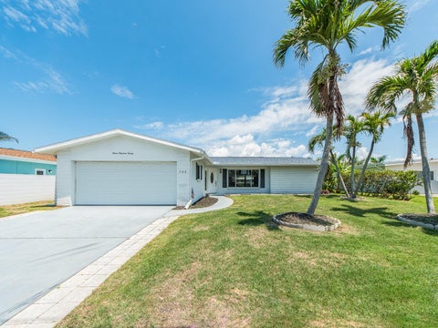 Photo of 720 115th Avenue, Treasure Island, FL 33706 (MLS # TB8517344)