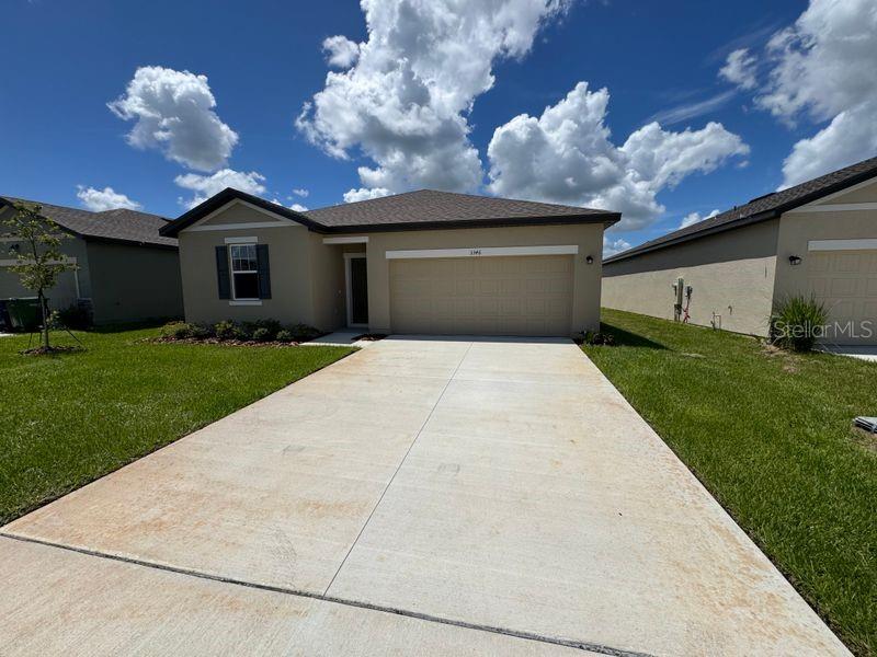 New construction home-never occupied- Winter Haven Fl. Be the first to live in this beautiful 3 bedroom, 2 bathroom home with 1600 sq ft of living space, offering comfort, convenience and modern design. Features include bright open floor plan with a spacious layout perfect for entertaining. Modern kitchen with stone countertops, large walk in pantry and plenty of cabinet space. Primary suite offers an en-suite bathroom with a generous walk in closet. Inside laundry laundry for extra convenience. Tile flooring in foyer and hallway for easy maintenance. Sliding glass door leading to a large backyard- ideal for gatherings or relaxing outdoors. Attached two car garage with level driveway and sidewalk. Range, refrigerator, microwave, dishwasher, disposal, washer, dryer and blinds are all included. Great location! Just minutes from Hwy 27,restaurants, shopping, the Chain of Lakes and Legoland Theme Park. Sprinkler is rclaimed water. Landlord request no pet.