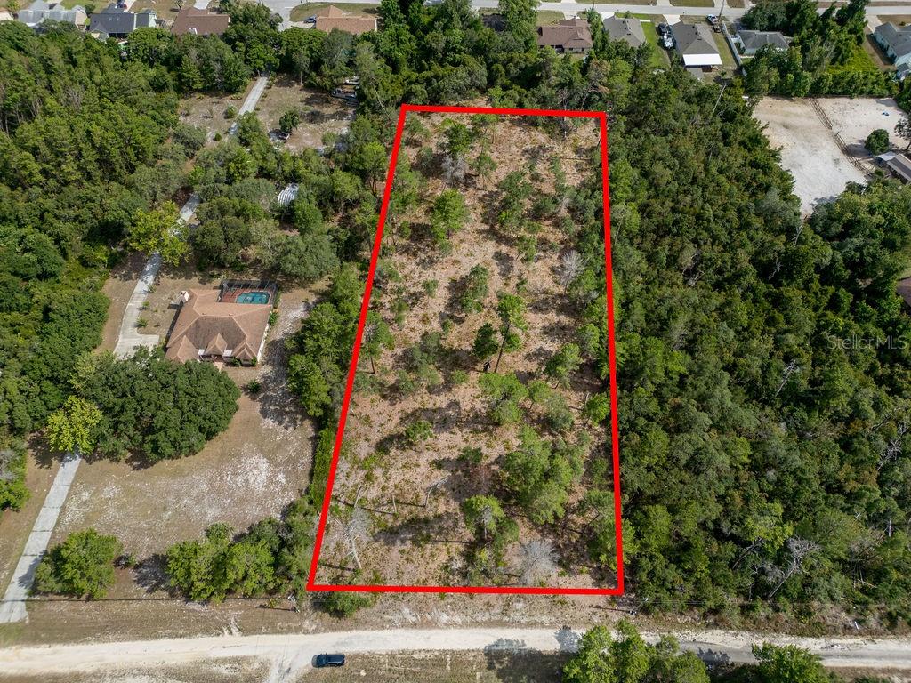 Imagine the home of your dreams nestled on a sprawling 2.60-acre lot, a canvas for your creativity and vision. This residential lot, zoned for agriculture, is high and dry, offering a solid foundation for your future abode. The land has been partially cleared, saving you time and effort as you embark on your building journey. The location couldn't be more convenient. Situated just off Howland Blvd, you're a mere 5-minute drive from I-4, ensuring easy commutes and quick access to amenities. But it's not all about practicality. This lot is about lifestyle too. You're just 40 minutes from the vibrant heart of downtown Orlando, where you can immerse yourself in a world of dining, shopping, and entertainment. And when you crave the soothing sounds of the ocean, the beach is only a 30-minute drive away. So, whether you're a beach lover, a city dweller, or a bit of both, this lot is perfectly positioned to offer you the best of both worlds. Come, build your dream home here, where convenience meets tranquility, and every day feels like a getaway.