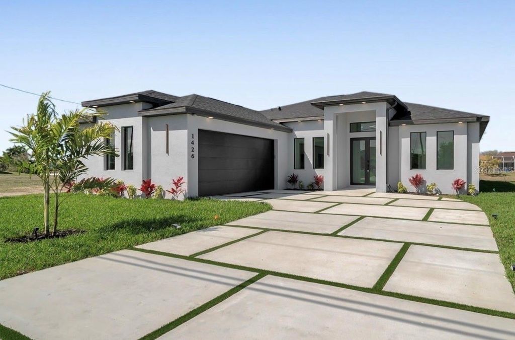 Photo of 1426 NE 6th Avenue, Cape Coral, FL 33909 (MLS # TB8501628)