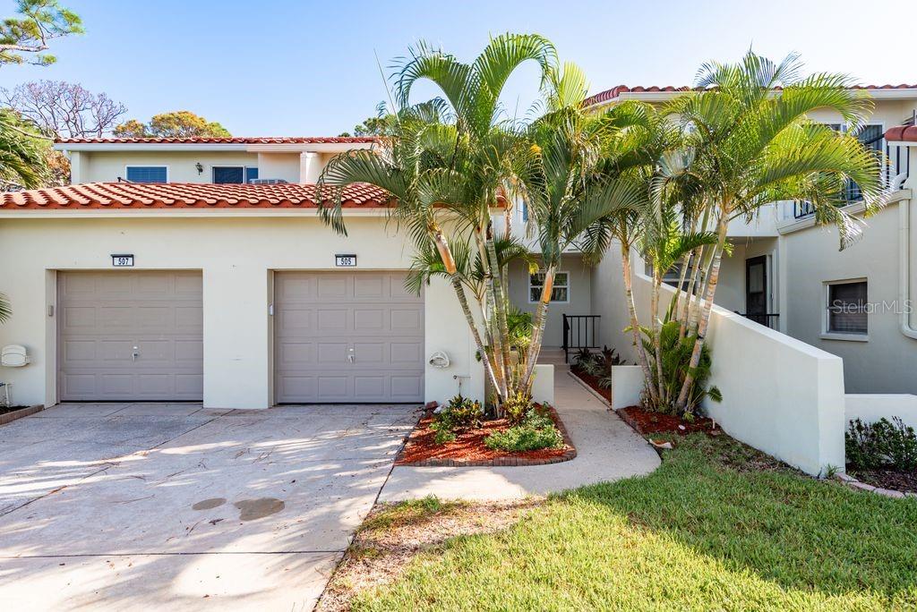Luxury waterfront living redefined in Dunedin. Welcome to 2700 Bayshore Blvd #505—a stunning 3-bedroom, 2.5-bath townhome showcasing breathtaking water views from both the front and back of the property, paired with flawless, top-to-bottom renovations and elevated design throughout. This residence has been fully transformed with no detail overlooked. Every component is new—including a brand-new AC, luxury vinyl plank flooring upstairs, new tile downstairs, quartz countertops, completely renovated kitchen and bathrooms, new windows, garage door, electrical panel, and more. An attached one-car garage offers convenience and storage, while the elevated living space sits outside the flood panel, providing added protection and peace of mind. Outdoor living is equally impressive. A spacious back patio opens directly to a private park with sweeping water views, creating a peaceful, scenic setting rarely found. A charming front porch and a private balcony off the primary suite offer additional spaces to relax and enjoy the tranquil surroundings. Situated just minutes from vibrant downtown Dunedin and the sugar sands of Honeymoon Island State Park, this location offers the best of coastal Florida living with nearby access to fine dining, boutique shopping, and easy connections to Tampa and St. Petersburg.
This is more than a home—it’s a luxuriously renovated coastal retreat, perfectly crafted for effortless living in one of the Gulf Coast’s most desirable communities.