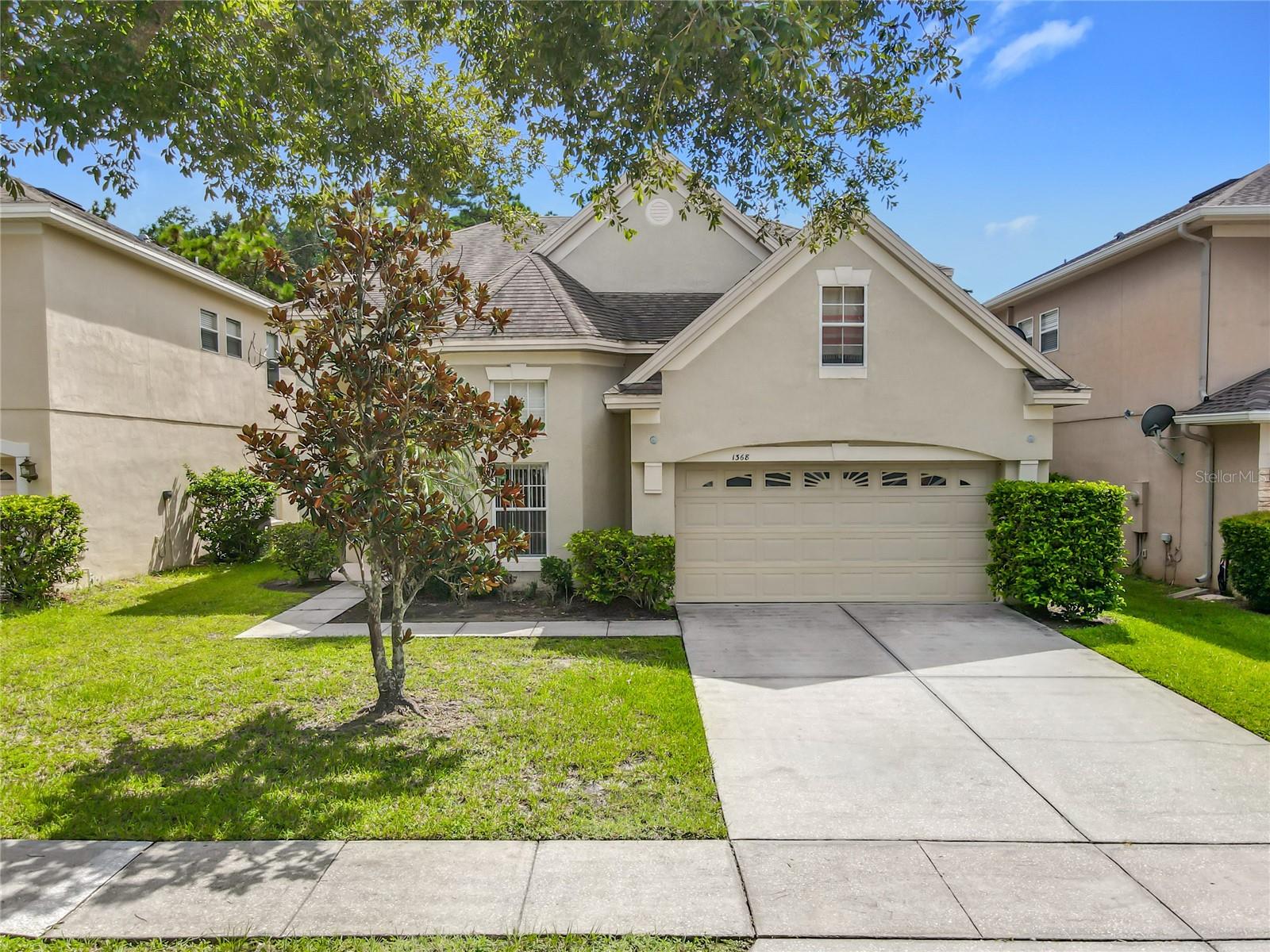 Beautiful conservation and water view home in the manned gated community of Woodland Lakes Preserve. From your first step into the home, you enter the large tiled foyer, and you are met with soaring ceilings. The living room tucked to the right features cherry wood floors as does the dining room. Moving forward, you enter the kitchen, with high cabinets, stainless steel appliances, granite countertops, and a separate eating nook overlooking the conservation. It is friendly and inviting, and overlooks the family room with vaulted ceilings, large sliding doors, and an open and bright feel. Off the family room is the large master suite with tray ceilings, two walk-in closets, and a full bathroom en suite. Also on the first floor, you will find the laundry room with a washer and dryer. Upstairs is a nice landing, three large bedrooms, and a sizable storage closet (misc. see pics). A covered patio outside provides a great relaxing spot, overlooking the pond and potential wildlife from the conservation. This is a great home! The garage was dented, but the replacement door has been ordered and will be replaced.
