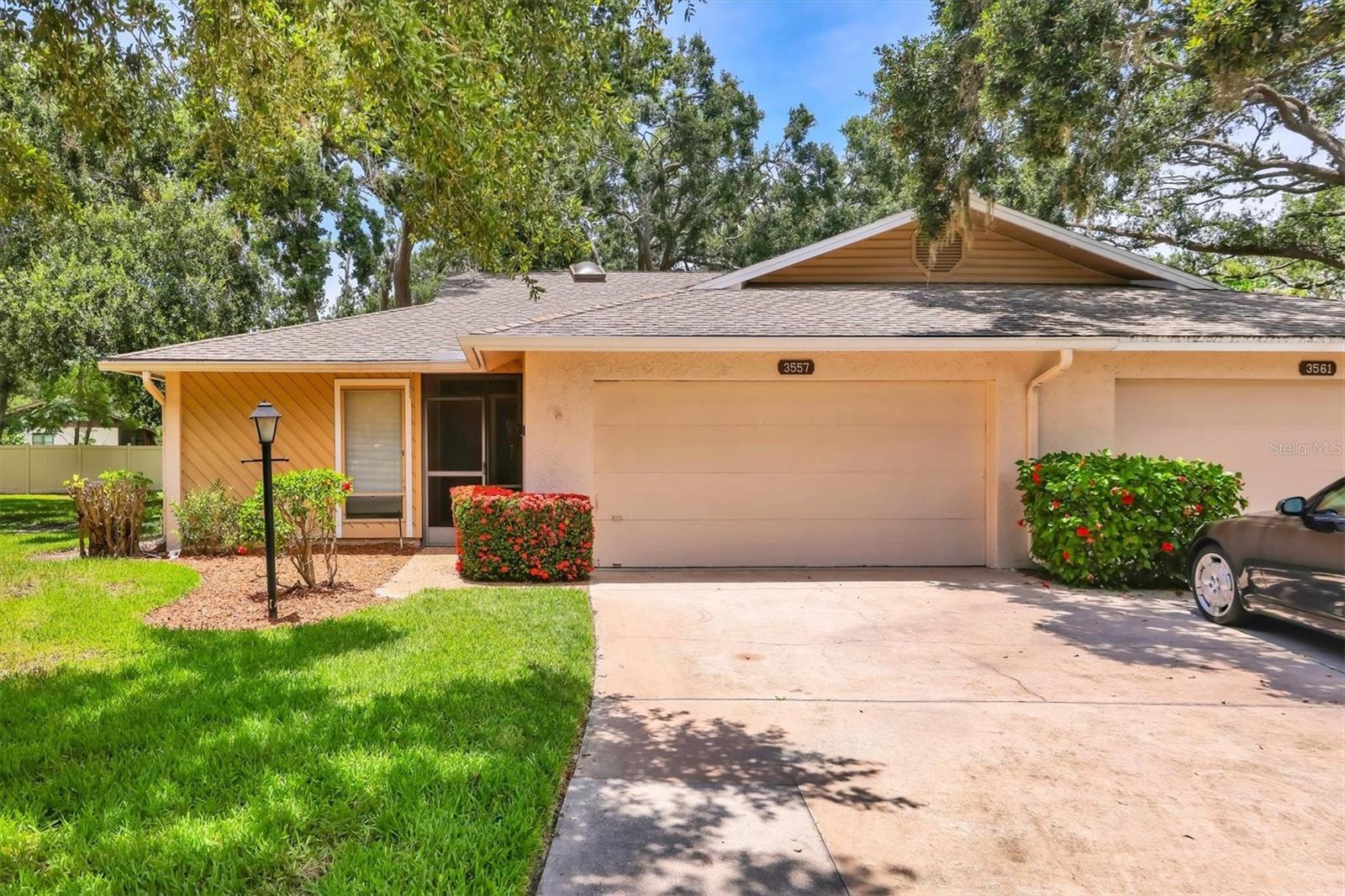Discover a rare opportunity in the tranquil community of Wilkinson Woods in Sarasota. This 2 bedroom, 2 bath villa with a 2 car garage offers spacious living and untapped potential in on the Sarasota's most convenient and established neighborhoods. The home features a bright living room, enhanced by skylights that fill the space with natural light. Surrounded by lush, mature landscaping, the villa provides a peaceful, private setting with a true Florida feel. Enjoy modern essentials such a high-speed internet access and take full advantage of the heated community pool and tennis courts which is perfect for an active lifestyle. Exterior maintenance is fully managed giving homeowners peace of mind and ease of ownership. This property presents an excellent opportunity for buyers looking to personalize a home to their tastes. It is clean and well-maintained. Whether your looking for a year-round residence or seasonal retreat, this villa offers flexibility and value in a prime Sarasota location. It is convenient to shopping, dining, and the area's beautiful beaches. Schedule your showing today and imagine the possibilities.