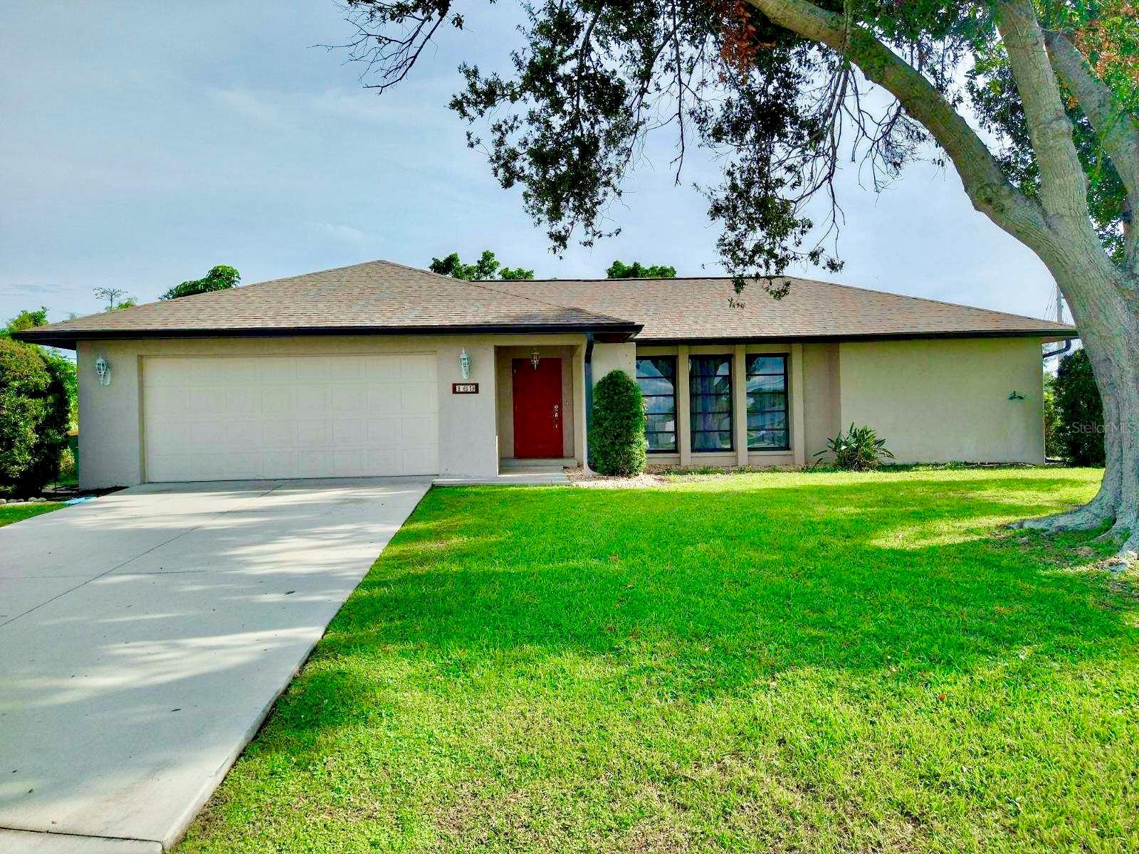 The perfect mix of Character and Florida Charm!!!! This Truly Fabulous Large 2 Bedroom/2 Bathroom, 2 Car Oversized Garage Offers a Spacious layout with a Living/Dining/Kitchen Combo combined with a Desirable Split Floor plan while also providing tones of Natural light with high ceilings in the Family Room/Breakfast Nook. Perfect for entertaining ALL who want to come to this tropical Oasis. It's located in the Prodigious and Well-Established Port Charlotte Community. This Beautiful Home offers so much to anyone looking for that perfect place to call their own. Perfectly Situated on a corner Lot surrounded by Lush Vegetation and mature Trees!!! Close to Charlotte Harbor for fishing, boating or walking the beautiful Paths. Enjoy Sipping coffee, Tea or Any refreshing drink on your fully enclosed back Lanai/Porch with Spa Hook-up ready to enjoy that serenity and peace. Homes upgrades include a 2023 Roof, 2021 Water Heater. Amazing Location with Quick access to Shopping, Restaurants and many other amenities and conveniences. Just a short drive to breathtaking Charlotte Harbor, the Peace River, Historic Downtown Punta Gorda, Community Centers, Schools, Parks, Shopping, Restaurants, multiple MLB Spring Training Complexes, World Class Fishing, Boating, Golfing, The Brand New Extravagant Sunseeker Resort and the World-Renowned Gulf Beaches of Southwest Florida!!! Do NOT miss the opportunity to make this home yours!!! SCHEDULE A SHOWING TODAY!!!