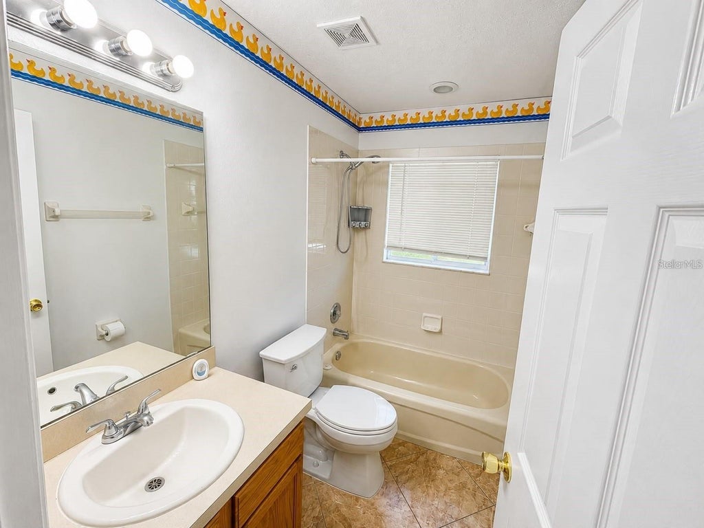 Photo of 320 Paradise Woods Place, Davenport, FL 33896 (MLS # O6447788)