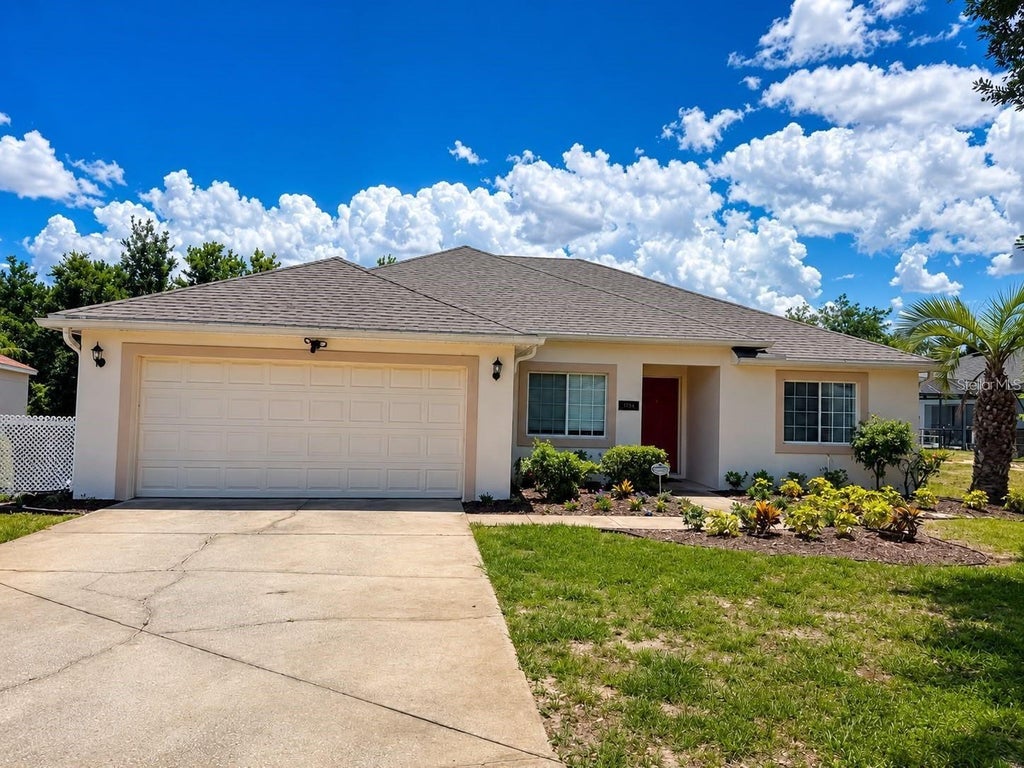 Photo of 320 Paradise Woods Place, Davenport, FL 33896 (MLS # O6447788)