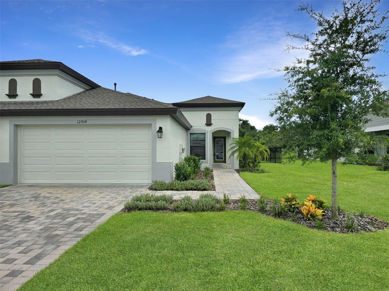 Annual rental in the sought-after community of Crosswind Point. This upgraded Bridgeport paired villa offers three bedrooms, two baths, a split floor plan, vaulted ceilings, a covered lanai, and a two-car garage. The open-concept kitchen is a chef’s delight, featuring quartz countertops, a spacious island, sleek grey cabinetry, a gas range, and a large pantry. Luxury vinyl plank flooring enhances the main living areas, while plush carpeting adds comfort to the bedrooms. Additional highlights include a screened lanai, fenced backyard, water softener, and ethernet connections in every room. Crosswind Point is a 230-acre resort-style community conveniently located near US-301 and just minutes from shopping, restaurants and schools and Healthcare. Residents enjoy scenic water and conservation views, a sparkling pool, and a cabana amenity center plus all within a low-maintenance lifestyle. Residents Benefits package added for an additional $35 per month. Available October 10, 2025. Come experience all that Crosswind Point has to offer! Small dog accepted. Tenant occupied 24- hour notice prior to showing.