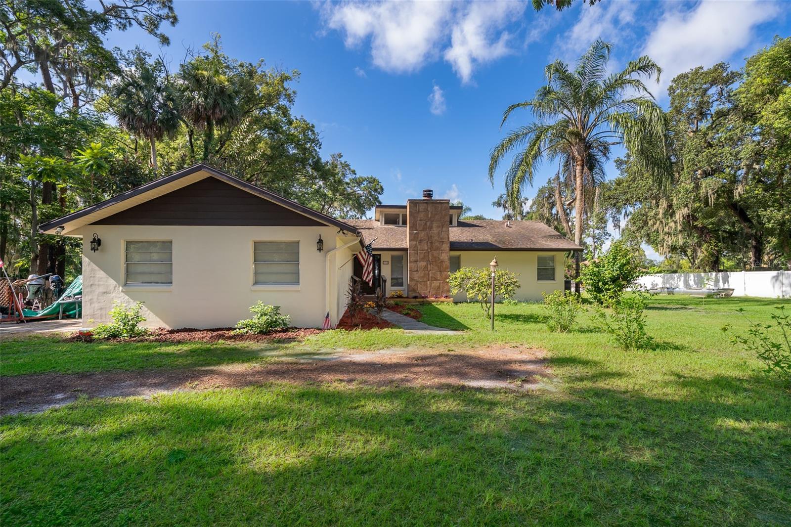 Welcome to this exquisite 4 bedroom, 3 bath one story LAKEFRONT home with NO HOA, perfectly nestled on a peaceful 1.27 acre lot in sought after Lake Mary. With breathtaking lake views, this property offers the ideal blend of luxury, comfort, and outdoor living. This home features a functional and open floor plan, with spacious living areas, ideal for both relaxing and entertaining. The FINISHED BASEMENT (1,539 SF) has been upgraded with a NEW lift station, providing extra versatility. The home has been meticulously maintained with several recent updates including: New luxury vinyl plank flooring throughout and stylish tile in key areas. Fresh INTERIOR & EXTERIOR PAINT in 2025, giving the home a modern look both inside and out. A newly installed SEPTIC TANK (2020) and A/C (2020). Newly added LED light fixtures and ceiling fans, adding energy efficiency and modern flair to every room. Step outside to your very own PRIVATE DOCK (recently painted in 2024), offering the perfect place for boating, fishing, or simply enjoying the serene surroundings. The OVERSIZED 2 car garage provides plenty of space for vehicles, storage, and projects, giving you the convenience of a spacious, clutter-free home. This home offers the best of Florida living with a beautiful combination of upgraded interiors, tranquil lake views, and ample outdoor space. Whether you’re enjoying a peaceful day on the water, hosting family and friends, or retreating to your private oasis, this property offers everything you need and more. LOCATION is convenient to 4 Hospitals, public transportation, elementary school, shopping, dining & more! Don’t miss the opportunity to make this stunning lakefront property your forever home!