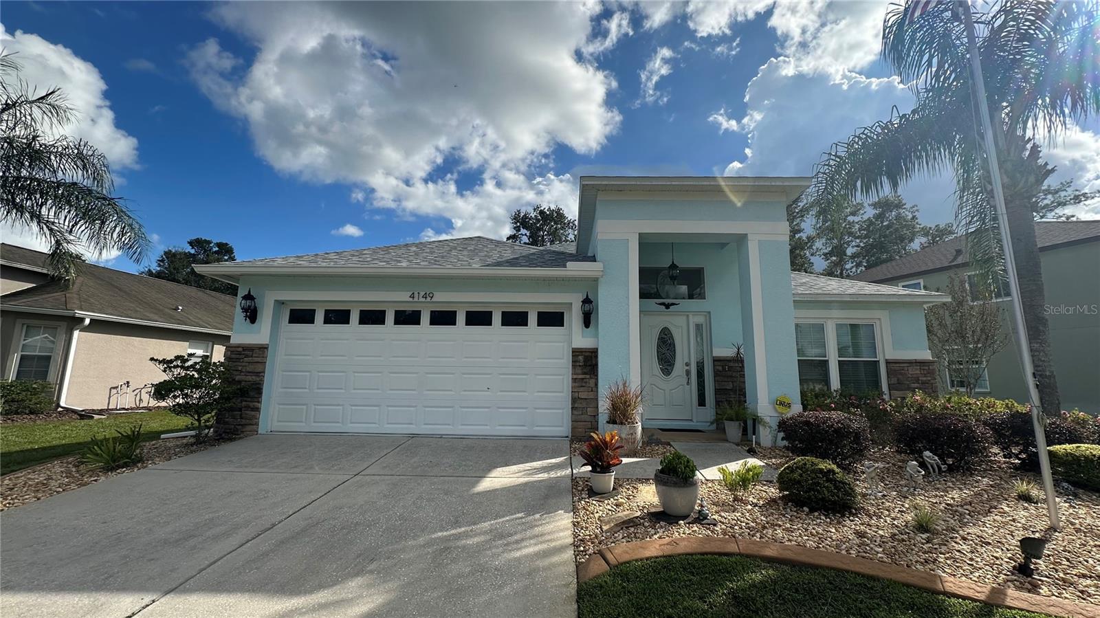 Why build when you can scoop up this beauty?! Pride of ownership shines through with this home. Sitting on the 5th fairway and pond front, this CLEAN AND WELL KEPT 3 bedroom plus office, 2 bathroom, 2 car garage boasts a beautiful and fresh front elevation with updated landscaping and curbalawn, flag pole, fresh light fixtures with hardwired up lighting and a garden/lawn irrigation system and NEW ROOF AND NEW WINDOWS with fresh exterior paint on the entire home. As you walk through the newly installed front door, you'll enter into the tiled foyer with newer laminate floors throughout the rest of the home. Formal dining and living room sit toward the front of the home with a kitchen in the center that overlooks an additional family room and dining nook towards the back of the home. Completely updated kitchen with quartz counter tops, subway tile backsplash, gas range, real wood cabinets, newer appliances, desk and a large pantry that provides plenty of storage. Security system stays. Guest bedrooms are large with big closets for even more storage space, indoor laundry room with washer and dryer, large garage with ceiling mounted storage shelves for additional storage. HUGE master suite with vaulted ceilings, plant shelves, office/sitting room, massive master closet and large bathroom with walk in shower, garden tub, new dual vanity with quartz counter tops and private toilet room. New dual pane windows installed throughout the home, AND SO MUCH MORE! Schedule your showing fast before this one is gone!