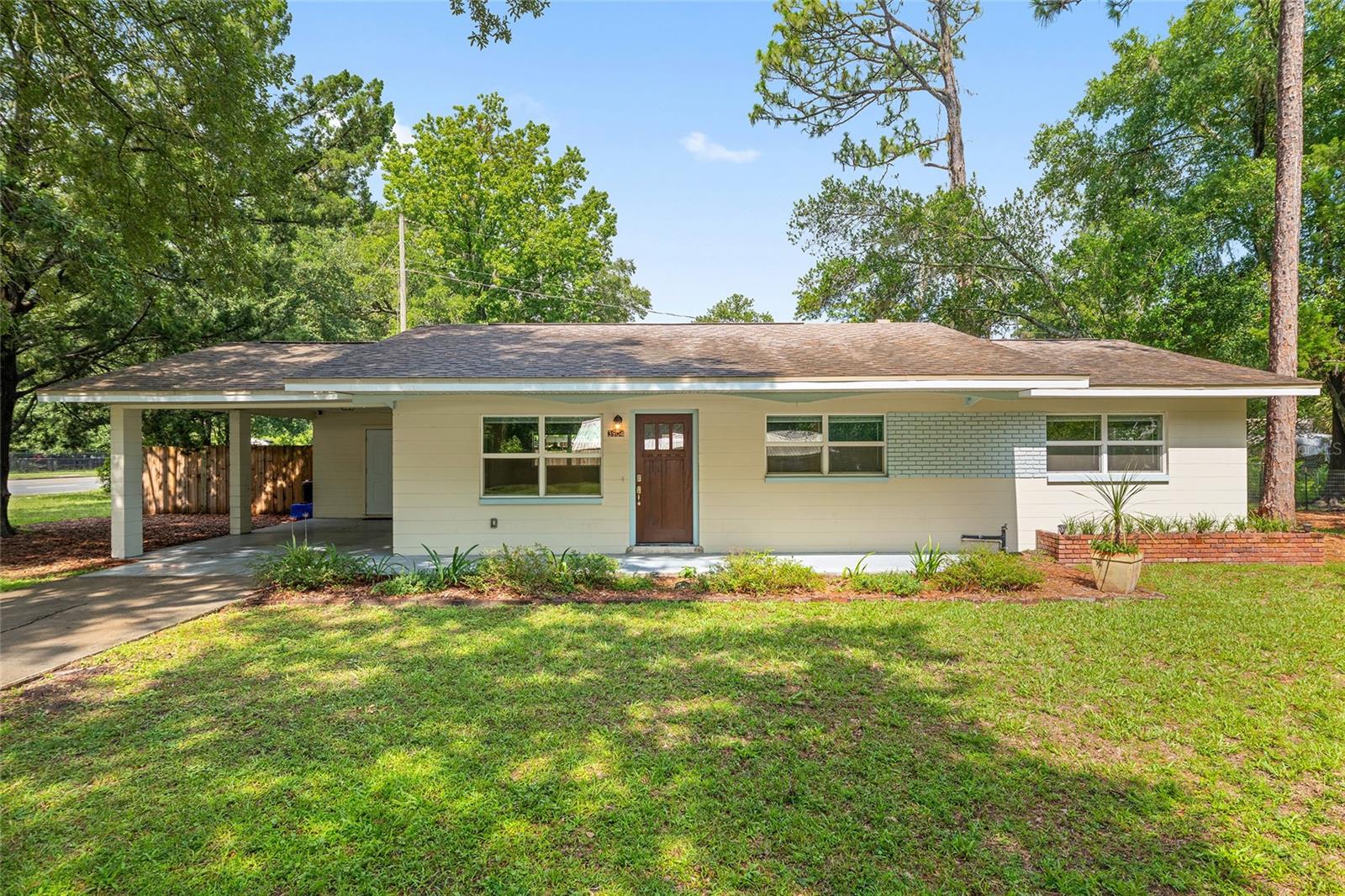 Move-In Ready Gem in NW Gainesville – No HOA! Welcome to this well maintained, clean-as-a-whistle 2-bedroom, 2-bathroom concrete block home with a flexible bonus space—perfect for a home office, play area or guest room! Open plan living area with lots of windows and natural light. Kitchen is modern, updated and has stainless steel appliances. No HOA and fully remodeled in 2017, including plumbing and electrical, with a 2016 roof, 2017 HVAC, and 2017 water heater—all the big-ticket items are done! You’ll love the easy to clean, beautiful tile floors throughout, fresh interior paint on walls and trim, and updated bathroom hardware, lighting and toilets. Stay secure and connected with the Cox Homelife system, which includes exterior cameras, door sensors, and a smart thermostat. Step outside to your own backyard oasis with Key lime and lemon trees—yes, enough fruit to bake homemade pies! Location can’t be beat—just off 39th Avenue, you’re within 5 minutes of multiple grocery stores, restaurants, and schools. Right across the street is Greentree Park, offering walking trails, a baseball diamond, and a playground for outdoor enjoyment. Make your appointment today—this well-cared-for home is truly a standout!