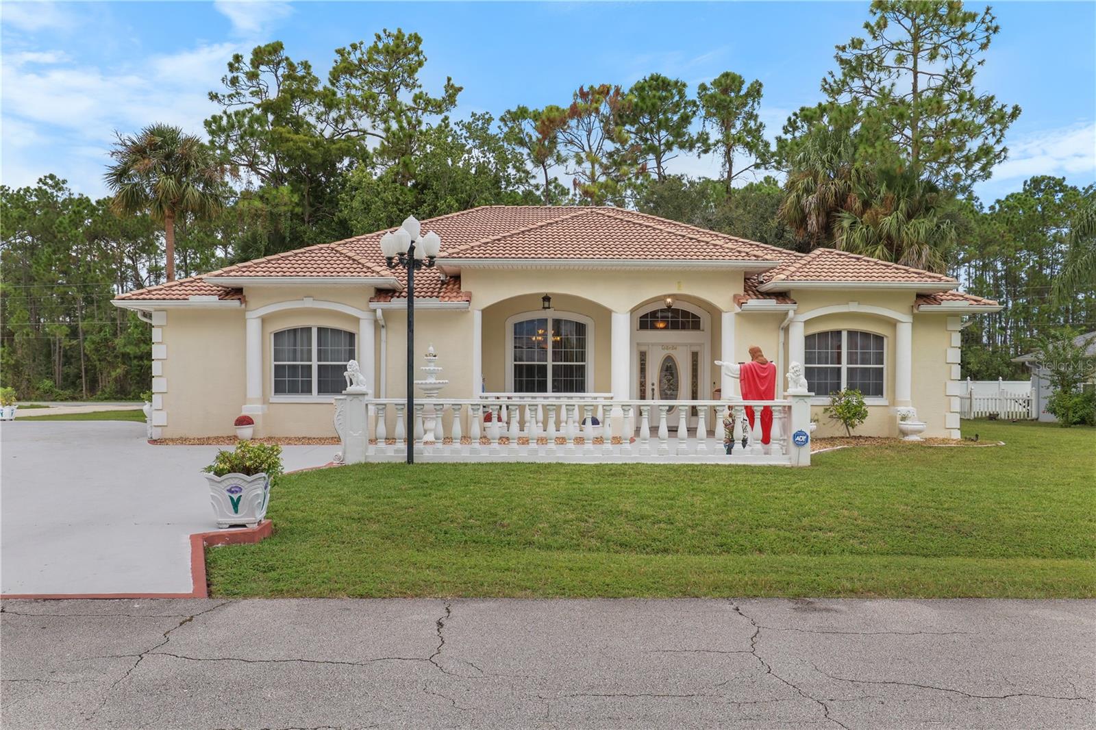 This beautifully designed concrete block stucco home stands out with its tile roof and light-filled interiors, offering exceptional comfort and functionality throughout. Ideally situated on a spacious corner lot, this property offers both curb appeal and extra outdoor space, just 6 miles from Flagler Beach and mere minutes from I-95, Target, and the Town Center — home to Publix, dining, and shopping. For golf enthusiasts, Cypress Knoll Golf & Country Club is right across the street.
Step inside to a thoughtfully crafted layout featuring a modern kitchen with stainless steel appliances, abundant cabinetry, a roomy pantry, and seamless flow into the dining area — perfect for everyday living and entertaining alike. The expansive primary suite serves as a peaceful sanctuary, complete with dual closets, a relaxing soaking tub, separate shower, and a smart layout designed for both comfort and privacy. Additional bedrooms are generously sized, ideal for guests, a home office, or creative flex space.
Enjoy serene mornings or lively evenings on the screened-in porch overlooking a large, fully usable backyard, perfect for a garden, play area, future pool, or cozy fire pit gatherings. A dedicated laundry room with upper cabinets and a deep sink adds everyday convenience.
This move-in-ready home is clean, well-cared for, and waiting for its next chapter.