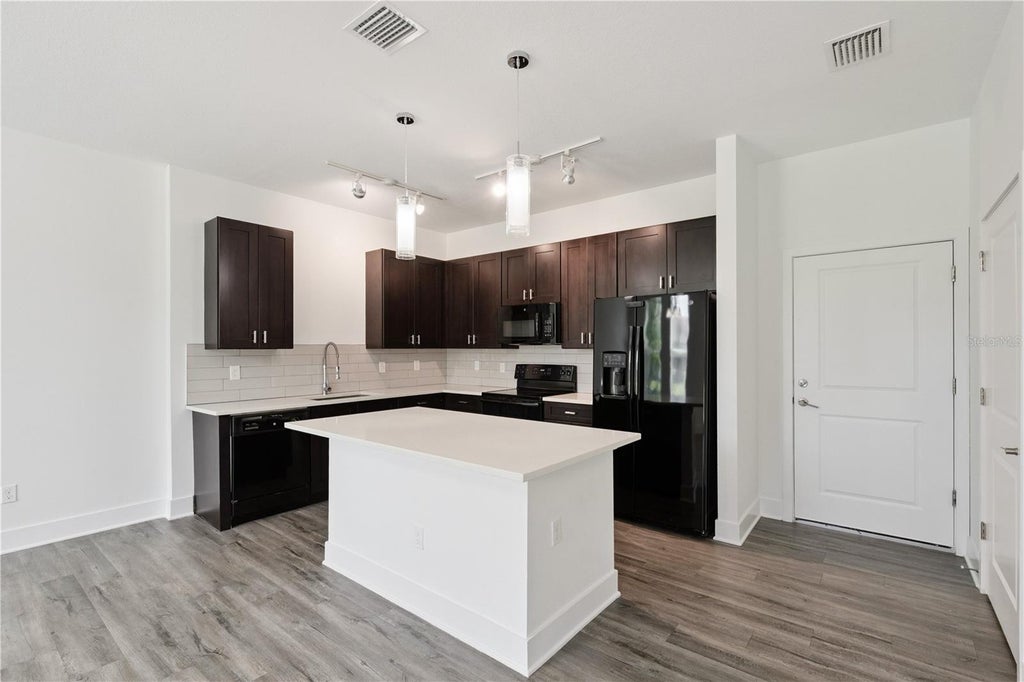 Photo of 1841 Houston Street, Kissimmee, FL 34743 (MLS # O6424504)