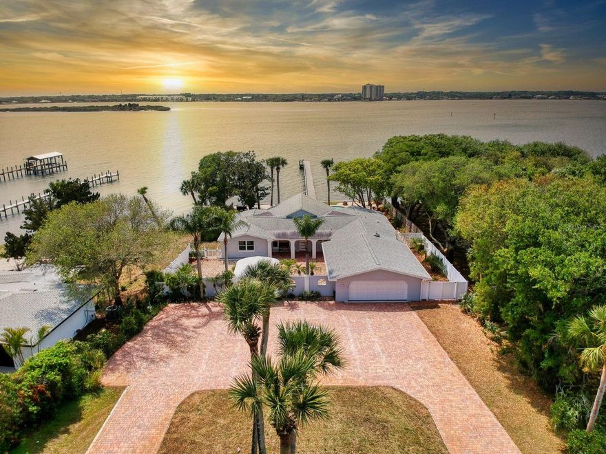 Have you ever dreamed about living on the River? Open the door to your new home with wide open views of the Intracoastal Waterway. Privately nestled behind a stone wall with an ornamental iron gate. Enjoy gorgeous sunsets with views from every room. Beautifully updated with wonderful modern conveniences. Tile in every room and a gourmet kitchen that would please the most discerning chef. Expansive granite countertops with 42 inch cabinets with room to store everything you could possibly need. Large Master Suite has a luxurious en suite bathroom including a huge walkthrough shower and a 16 X 6 foot custom-built closet. The home features spacious guest bedrooms that can also be used as home office/den. Enjoy the deep lot with in-ground custom pool, overlooking the Intracoastal. More... ;Water: City