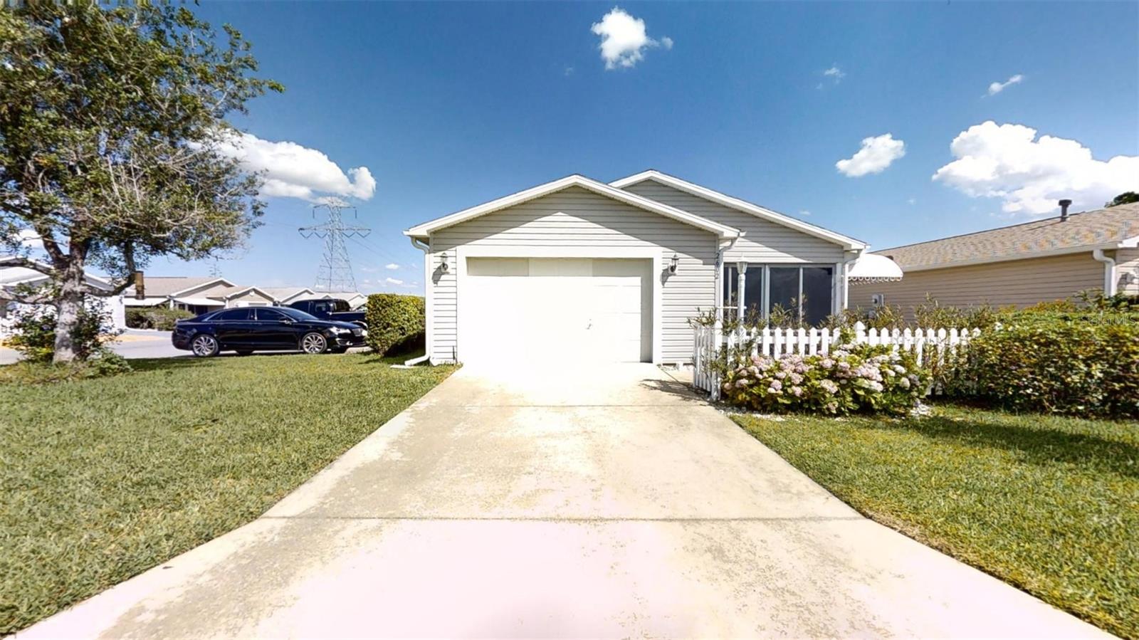 ***NEW PRICE **ATTENTION 55+ BUYERS: INCREDIBLE VALUE FOR A 2 BED 2 BATH CORNER MODEL. NO BOND OPPORTUNITY IN VILLA DE LEON COLONY MODEL VILLA IN THE VILLAGES, FL. INCLUDES BUYER 1 YEAR HOME WARRANTY.** DON'T MISS THIS CHANCE TO OWN YOUR DREAM HOME IN THE MOST DESIRABLE 55+ LIFESTYLE COMMUNITY IN AMERICA. THIS GOLF CART FRIENDLY MOVE-IN READY 2-BEDROOM, 2 BATH VILLA POISED TO BECOME YOUR PERSONAL SANCTUARY. THIS HOME BOASTS REAL HARDWOOD FLOORS THROUGHOUT, TILE IN THE LANAI. KITCHEN AND BATHS. ENJOY ALL SEASON READY LANAI. RENOVATED HALL BATH. NEW VANITY SINK & FAUCET IN ENSUITE. FRESH INTERIOR PAINT. WIRED SURROUND SOUND IN THE LIVING DINING AREA. 2015 GAS WATER HEATER. 2016 AC UNIT. 2019 NEW ROOF. 2022 DISHWASHER. 2023 WASHER. CURRENTLY GAS APPLIANCES ARE DRYER, FURNANCE & WATER HEATER. ACCORDING TO TECO, GAS RANGE SERVICE IS AVAILABLE.. SPACIOUS LIVING AND DINING AREA, READY FOR YOUR PERSONAL TOUCHES. THE THOUGHTFULLY DESIGNED LAYOUT SEAMLESSLY BLENDS FUNCTIONALITY WITH ELEGANCE, OFFERING AMPLE SPACE FOR BOTH RELAXATION AND ENTERTAINMENT. EXPLORE THE SURROUNDING COMMUNITY AND DISCOVER VIBRANT GOLF, SWIMMING, CLUBHOUSES, SOCIAL ACTIVITES, ASSORTED SPORTS, CLUBS, GROUPS AND MORE. ENJOY TRANQUIL STROLLS ALONG MANICURED PATHWAYS. EVERY MOMENT PROMISES A NEW ADVENTURE! EMBRACE THE ESSENCE OF THE VILLAGES, FLORIDA LIFESTYLE AND MAKE THIS ENCHANTING VILLA YOURS TODAY! LESS THAN A MILE TO BANKING, RESTAURANTS, PUBLIX, SHOPPING & MEDICAL SERVICES. LOCATED JUST ~3 MILES FROM SPANISH SPRINGS, ~6 MILES FROM LAKE SUMTER LANDING, ~11 MILES TO BROWNWOOD, AND ~15 MILES TO SAWGRASS GROVE. **CALL TODAY FOR IN PERSON SHOWING OR TOUR ANYTIME WITH THE INCLUDED TRUE-TO-LIFE 3D TOUR. SEIZE THIS OPPORTUNITY AND MAKE THIS HOUSE YOUR HOME, TODAY!**