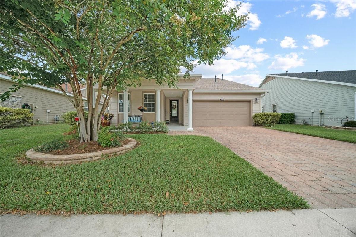 The one and only Colonial style Nice floor plan on the ALL AGES side of the community built by Shea offers HUGE covered front porch and sits across from the walking biking trail. Ceramic tile flooring throughout so no carpet!! Privacy all around this home creates a peaceful environment for living in this resort community. ……………….. The following improvement were completed within the past 12 months (totaling almost $60,000): 2024: Interior and Exterior painting, brand new 42” kitchen cabinets (normally only available in the larger homes) with crown molding, soft-close hinges and glides and dovetail drawers with full overlay and pull-outs in all the base cabinets and both over and under cabinet lighting. New DRAWER MICROWAVE! Touch-free kitchen faucet, tile backsplash, new ceiling fan in primary bedroom, additional lighting in 3rd bedroom/den and master bedroom, new contemporary barn door in master bedroom and new garage door opener with wi-fi capability, security system, patio door placed with blinds in the glass insert so you don’t have blinds banging every time you open the door. Also, termite bond put in place including preventive treatment in in the attic area and bait stations……………….. 2025: NEW ROOF WITH 50 YEAR WARRANTY (BATTERBEE ROOFING)! Brand new landscaping in front and extended pavers in the back for gorgeous outdoor living space. This home also features ceiling fans throughout, natural gas cooking, heating, hot water and dryer, spacious smart-space laundry room complete with cabinets and desk as well as utility sink, ceiling racks for storage in garage, and cabinets installed in garage for storage and workspace, water softener. Pantry is huge with custom spice rack on door! Quartz counters in kitchen and baths, master closet has custom built-ins and primary bathroom mirrors are framed out for a custom look. Primary bathroom closet has custom built-ins and shower is low profile/easy access with nothing to step up and over into with built in shower seat. Enjoy backyard oasis with paver patio, pergola with swing and mature landscaping. The custom wooden benches also afford privacy and yard is completely fenced in. Note, the property line extends approximately 7.5’ beyond the rear fence. Or enjoy one of the largest front porches shaded by mature crepe myrtle. Ocala Preserve is a resort lifestyle community and HOA covers lawn and landscape maintenance (cutting, edging, trimming, treating, mulching, fertilizing, irrigation system and water for irrigation), high speed internet, membership in all amenities including indoor and outdoor fitness areas, group fitness classes, 20 miles of dedicated trails for walking and biking, bocce, horseshoe, tennis, pickleball, fishing doc, kayaks, canoes, paddleboat. As a homeowner you also receive discounts in the on-site restaurant, golf course and space for massages, facials, mani-pedi. This area has no CDD assessments.