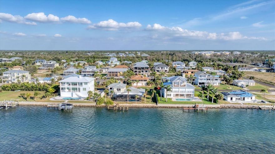 Offers the most sought after tropical waterfront views of Lemon Bay & the Intracoastal Waterway! Featuring 107 ft of waterfront and a new dock. Located in the Cape Haze/Palm Point (Marker 8) section of Englewood! Luxury Coastal Living & Lifestyle at its finest! Stunning Westerly sunsets everyday & Nature Lover's oasis where the dolphins, manatees & mullets frolic and the pelicans perch. Calling all boater and fishing enthusiasts! Direct Intracoastal Waterway & Gulf Access. No bridges and quick ride to Stump Pass, Palm Point, Manasota Key, Englewood Beaches, Stump Pass, Tiki Bars, Live Entertainment and Fine Dining. Adventure to the Stump Pass and Don Pedro State Parks, Boca Grande, Charlotte Harbor and beyond. Quiet dead-end street with no HOA! Completely renovated eloquent home with a primary suite on the second story featuring Impact sliders out to your private balcony overlooking the Intracoastal. Perfect place for a morning cup of coffee while the wildlife is waking up or a peaceful sunset view in the evening. The second floor allows for flexibility to meet your lifestyle. You could create an office corner, workout area and additional lounging. The primary bathroom offers a luxurious soaking tub with water view, a huge open shower, and a double sink vanity. Plenty of storage and counterspace including a make-up sitting area. The His and Her walk-in closet provides plenty of storage. This unique architecture of this home is eye catching as you pull into the circular driveway surrounded by stunning landscape designs. You have 2 garage doors for 2 parking bays, huge storage closet and a spacious laundry room. Entering via the front entrance of the home, you are hit with a WOW factor of the large open floorplan of the living room, dining area and kitchen all with DIRECT breathtaking views out to the pool and water. The pocket sliders completely open for unobstructed views and access to the pool and oversized patio and lanai. All the windows have new Plantation Shutters that can be open to allow for a flow of natural light throughout the entire home. As you peruse, you will notice the exquisite details; tall baseboards & double crown molding. The new kitchen quartz subtle swirls compliment the new tile plank ceramic flooring. The guest suite is off to the left of the living room with 2 bedrooms divided by a classy bathroom. The 3rd bathroom is located on the opposite side of the living room/kitchen which also serves as the pool bath complete with a new walk-in shower. You and your guests have easy access from the backyard through the backdoor into the laundry room and home. For extra convenience, there are 2 back doors from the garage and another side door by the dinette. Huge lanai space offering optimal entertainment and options to add a tiki bar and outdoor kitchen. 2025 Pool Cage & Screens, Pool Heat Pump, Dock and 6 New Pilings. 2025 Impact Windows,& Sliders, two central A/C units, New Plumbing, Electric Panel & two Water Heaters, one tankless! 2023 Roof. Don't hesitate and call for your private showing of this Peaceful Place in Paradise!