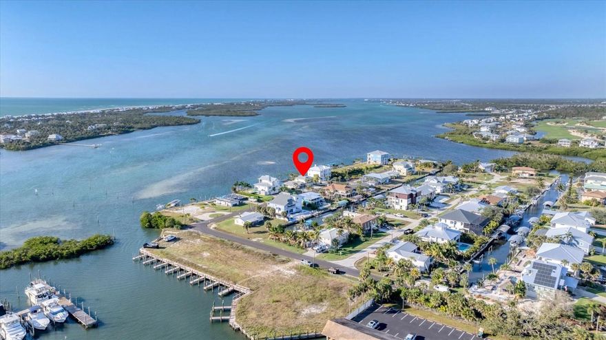 Offers the most sought after tropical waterfront views of Lemon Bay & the Intracoastal Waterway! Featuring 107 ft of waterfront and a new dock. Located in the Cape Haze/Palm Point (Marker 8) section of Englewood! Luxury Coastal Living & Lifestyle at its finest! Stunning Westerly sunsets everyday & Nature Lover's oasis where the dolphins, manatees & mullets frolic and the pelicans perch. Calling all boater and fishing enthusiasts! Direct Intracoastal Waterway & Gulf Access. No bridges and quick ride to Stump Pass, Palm Point, Manasota Key, Englewood Beaches, Stump Pass, Tiki Bars, Live Entertainment and Fine Dining. Adventure to the Stump Pass and Don Pedro State Parks, Boca Grande, Charlotte Harbor and beyond. Quiet dead-end street with no HOA! Completely renovated eloquent home with a primary suite on the second story featuring Impact sliders out to your private balcony overlooking the Intracoastal. Perfect place for a morning cup of coffee while the wildlife is waking up or a peaceful sunset view in the evening. The second floor allows for flexibility to meet your lifestyle. You could create an office corner, workout area and additional lounging. The primary bathroom offers a luxurious soaking tub with water view, a huge open shower, and a double sink vanity. Plenty of storage and counterspace including a make-up sitting area. The His and Her walk-in closet provides plenty of storage. This unique architecture of this home is eye catching as you pull into the circular driveway surrounded by stunning landscape designs. You have 2 garage doors for 2 parking bays, huge storage closet and a spacious laundry room. Entering via the front entrance of the home, you are hit with a WOW factor of the large open floorplan of the living room, dining area and kitchen all with DIRECT breathtaking views out to the pool and water. The pocket sliders completely open for unobstructed views and access to the pool and oversized patio and lanai. All the windows have new Plantation Shutters that can be open to allow for a flow of natural light throughout the entire home. As you peruse, you will notice the exquisite details; tall baseboards & double crown molding. The new kitchen quartz subtle swirls compliment the new tile plank ceramic flooring. The guest suite is off to the left of the living room with 2 bedrooms divided by a classy bathroom. The 3rd bathroom is located on the opposite side of the living room/kitchen which also serves as the pool bath complete with a new walk-in shower. You and your guests have easy access from the backyard through the backdoor into the laundry room and home. For extra convenience, there are 2 back doors from the garage and another side door by the dinette. Huge lanai space offering optimal entertainment and options to add a tiki bar and outdoor kitchen. 2025 Pool Cage & Screens, Pool Heat Pump, Dock and 6 New Pilings. 2025 Impact Windows,& Sliders, two central A/C units, New Plumbing, Electric Panel & two Water Heaters, one tankless! 2023 Roof. Don't hesitate and call for your private showing of this Peaceful Place in Paradise!