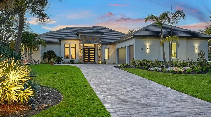 Welcome to a residence where contemporary elegance meets unparalleled convenience. Built in 2018 by John Cannon Custom Homes, this three bedroom, three bath home is the first newer construction property to become available for sale in The Landings. Situated on a half-acre lot, it is privatized by lush, tropical landscaping. A spacious, open floor plan has 12-foot ceilings & abundant windows all are high-impact. There’s a bar, den, office, and an outdoor kitchen in the covered lanai. Unwind in the large heated spa. Designer features are abundant throughout. The kitchen has Thermidor appliances, wood cabinetry, quartz & granite countertops, and a large walk-in pantry. The spacious owner's retreat has customized walk-in closets, a spa -like bath with an oversized zero-entry shower. On a split floor plan, guests will enjoy bedrooms and private baths that open to a small courtyard. The three-car garage has epoxy floors and a large, lockable storage closet. In addition, there is a Kohler Generator, 500-gallon propane tank and in-wall perimeter pest control. Walk to The Landings Racquet Club to enjoy the amenities of tennis, fitness center, swimming pool and water access for kayaking and fishing. Convenient to shopping and dining at The Landings Shopping Center and a quick drive to both Siesta Key and Downtown. This is what you have been waiting for. Dream it, Live it!