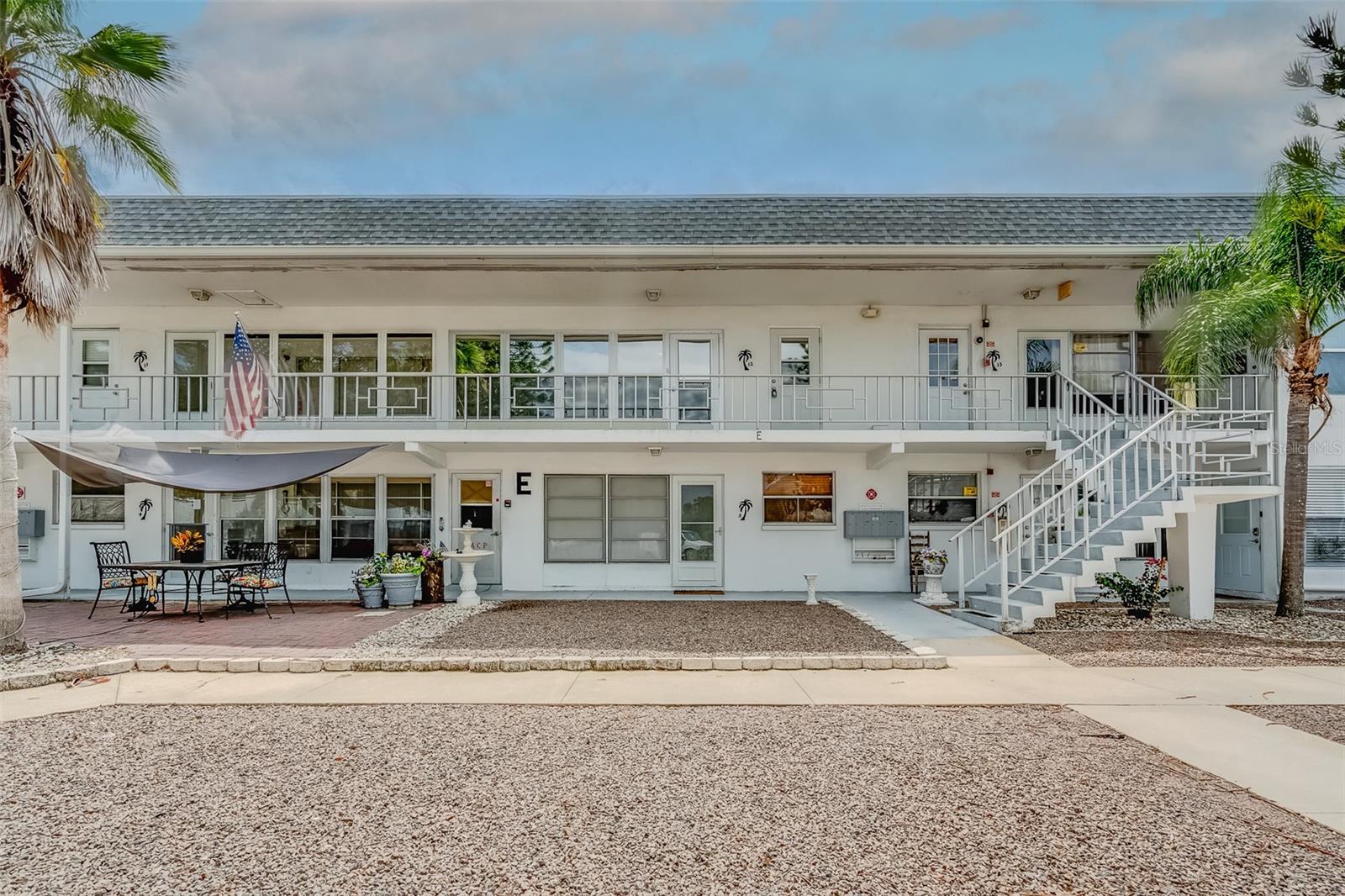 Welcome home to this bright and airy 2 bedroom/ 1 bath condo in the heart of Clearwater! This is a 55+ community just minutes away from Clearwater Beach, Pinellas Trail, golf, shopping, spring training baseball, and the St Pete/Clearwater airport! This second floor condo features an open living area, spacious bedrooms, and a large enclosed balcony perfect for evening reading and morning coffee! Communal laundry is right downstairs and offers Aaxon Pay which means no coins! Building E received a NEW roof in August of 2022, NEW HVAC in 2023, NEW granite counter tops in 2023, and NEW luxury vinyl flooring in 2023! This unit is move in ready and ready for full time living or the perfect seasonal getaway! NON-FLOOD ZONE/NON EVACUATION ZONE/ NO STORM DAMAGE!