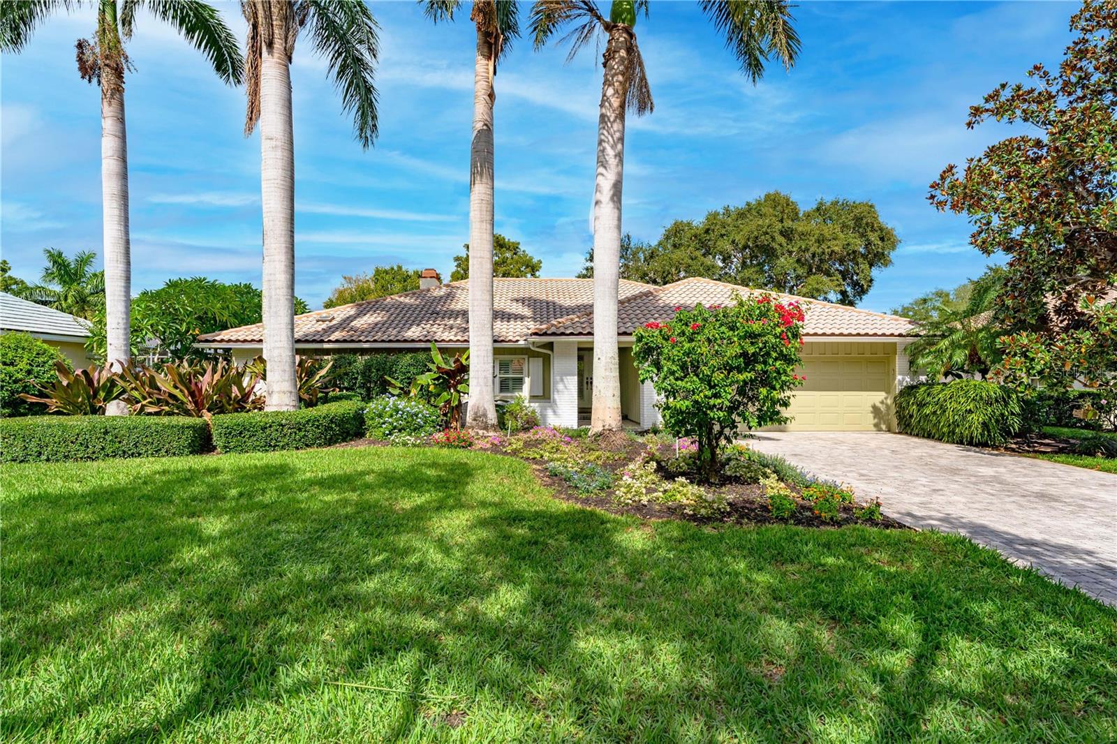 For Sale with immediate income opportunity: Tenant occupied w/ lease until March 2027. Immaculate lakefront pool home in the exclusive gated neighborhood of The Landings in South Sarasota. One of the few homes in The Landings situated on a lake with breathtaking sunset views over the heated pool and screened lanai. No flood insurance is required and absolutely no storm damage was sustained. Completely updated home boasting 3 bedrooms, plus laundry/office/massage room, 2 updated bathrooms and an oversized 2 car garage. Quartz countertops in the kitchen and stainless steel appliances will make you feel like a chef! Plenty of space for formal dining, in the dining area, on the extended pool deck or casual dining at the breakfast bar. All tile throughout, this home has been recently painted and meticulously maintained. The master bedroom offers 2 large walk in closets as well as direct access out on to the pool deck! The pool deck & back yard oasis is accessible by a wall of impact sliding glass doors, and your outdoor living space is now one with your indoor living. Covered porch with fans and screen allow for year round enjoyment. the home is offered unfurnished. Current furnishings belong to the tenant who has an excellent track record of on time payments and would love to stay. Coveted west of the trail location this home is an excellent investment opportunity. There is the option to use the onsite Landing's Racquet Club for a small fee. There is also an active tennis program with eight har tru clay courts, pool with spa, a fitness room and social activities. Landscaping has also been upgraded. Video Tour of the home available.
