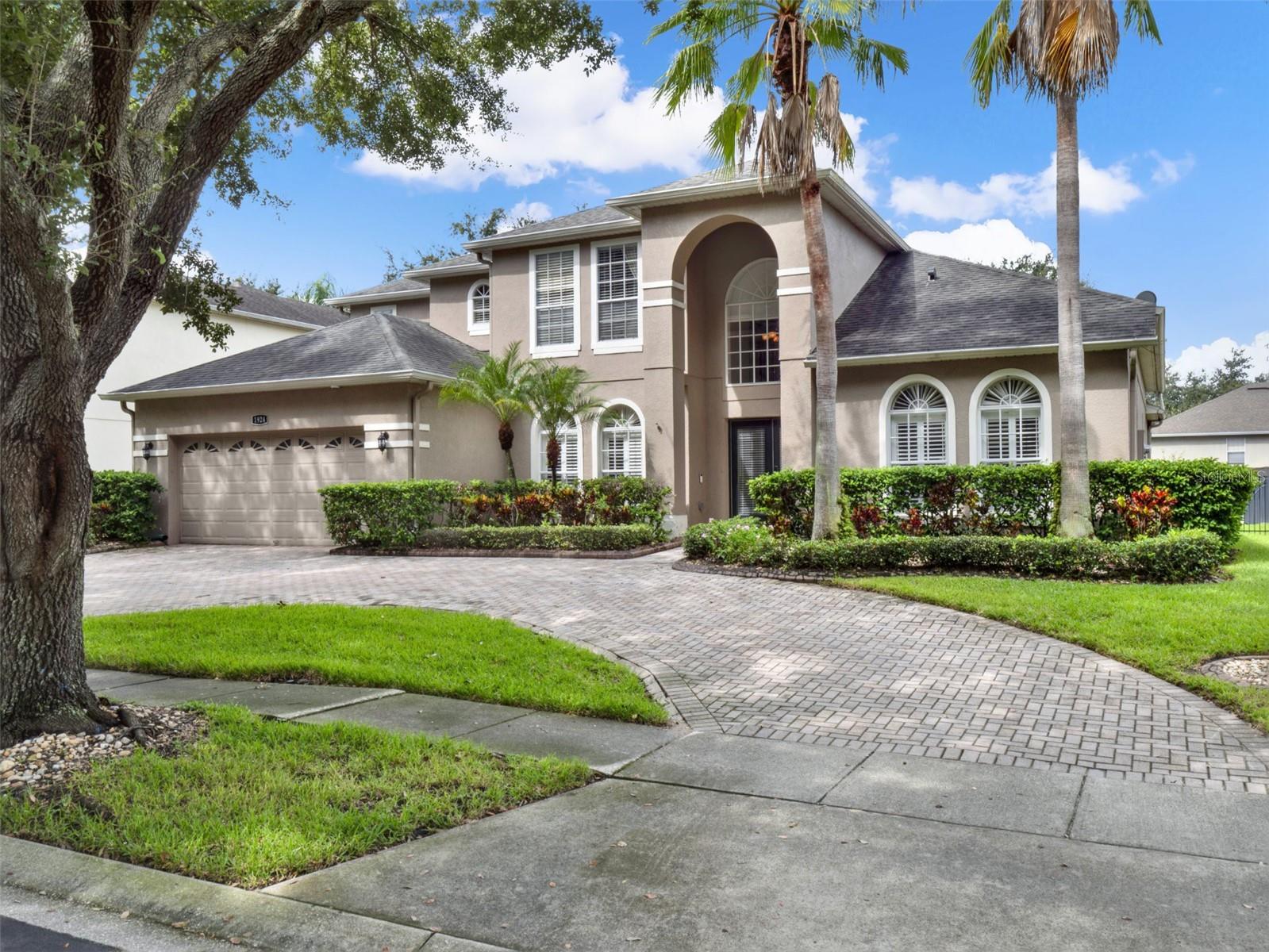 Welcome to your dream home in the exclusive gated community of Westover Club, ideally situated in highly sought-after East Windermere and zoned for top-rated Thornebrooke Elementary, Gotha Middle, and Olympia High School. This expansive 5-bedroom, 3-bathroom executive residence offers over 3,600 square feet of elegantly upgraded living space, perfectly blending comfort, functionality, and luxurious touches throughout.
Step into an inviting and versatile floor plan that features formal living and dining rooms, a large family room, and a dedicated office or den, ideal for today’s lifestyle needs. The gourmet kitchen is a chef’s delight, showcasing upgraded 42” cabinetry, granite countertops (inside and out), travertine flooring, a large center island, wine cooler, built-in desk, top-quality stainless steel appliances, and a breakfast bar and nook.
The first-floor primary suite is a true retreat, generously sized to include space for a sitting area or desk, with direct pool access, a spacious walk-in closet, and a luxurious ensuite bath featuring dual vanities, a garden tub, and a separate tile-enclosed shower. A first-floor guest bedroom with full bath, perfect as a mother-in-law suite, offers privacy on the opposite side of the home.
Upstairs, the entertainment continues in the oversized bonus room, complete with a 100-inch movie screen, HDTV projector, and ample space for game nights or relaxing movie marathons. Three additional extra-large bedrooms and a full bath complete the second level.
Enjoy true Florida living in your screen-enclosed, solar-heated saltwater pool and spa, surrounded by an expansive covered lanai with summer kitchen, including an Alfresco grill and ample patio space,perfect for entertaining family and friends year-round.
Community amenities include tennis courts, basketball, and a private park, all within the security of a gated neighborhood. With a roof replaced in 2017 and a newer HVAC system, this home is move-in ready and insurance-friendly. Located just minutes from SR 408, Universal Studios, SeaWorld, Disney, and the Mall at Millenia, this property offers convenience, community, and a lifestyle to love.