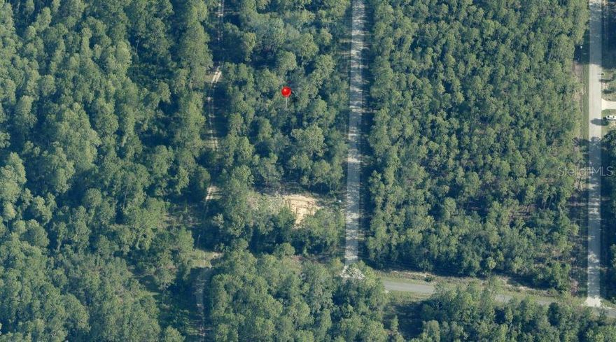 .24 acre lot in residential Rainbow Lakes Estates.