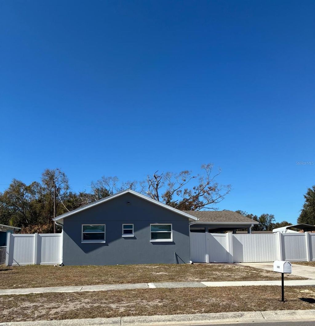 Photo of 1409 Wishing Well Way, Tampa, FL 33619 (MLS # TB8474141)
