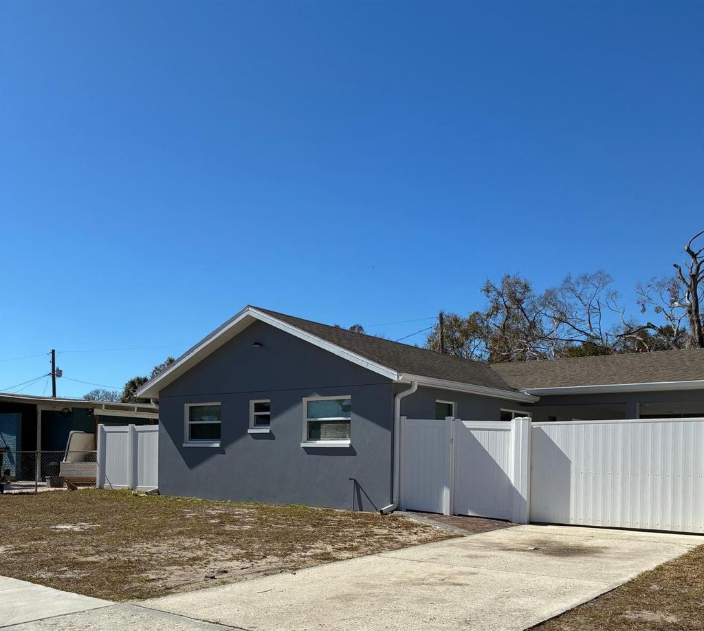 Photo of 1409 Wishing Well Way, Tampa, FL 33619 (MLS # TB8474141)
