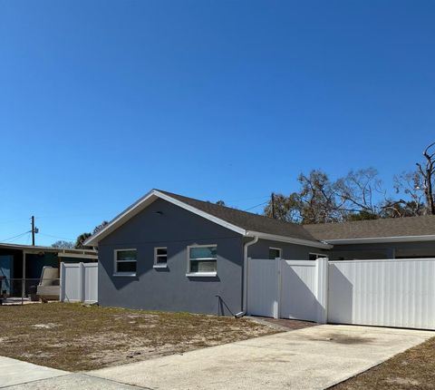 Photo of 1409 Wishing Well Way, Tampa, FL 33619 (MLS # TB8474141)