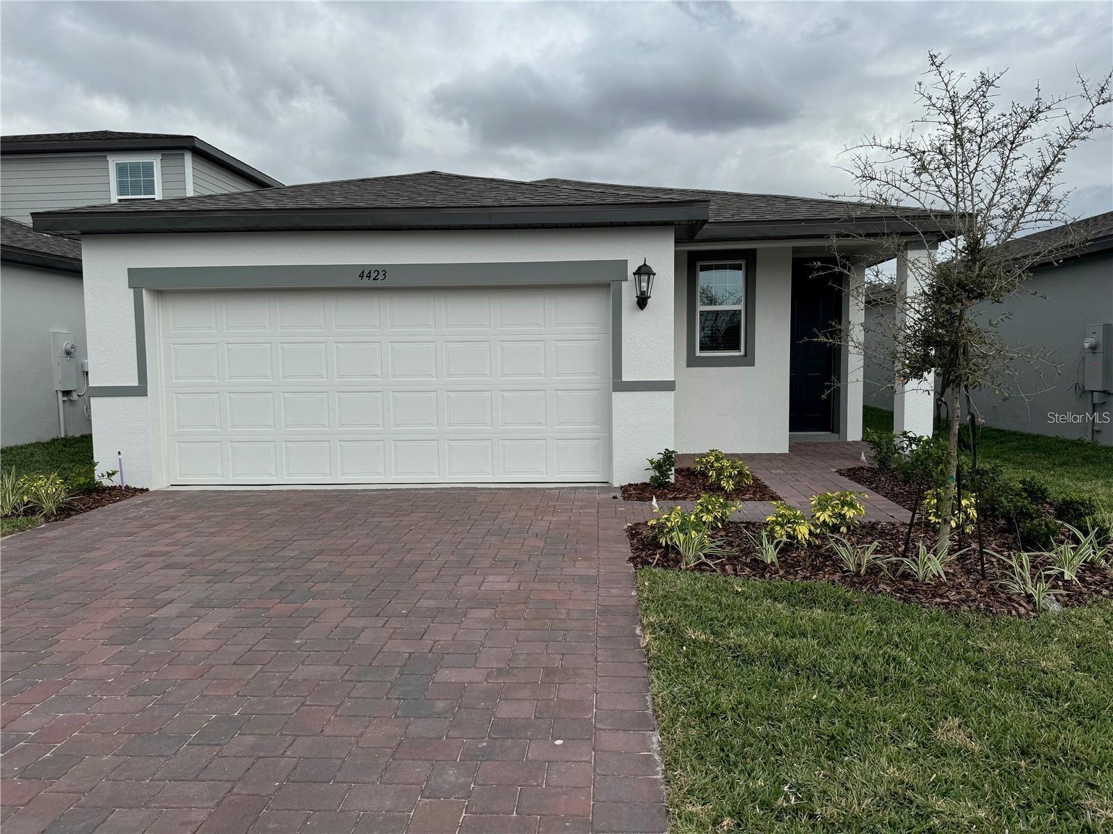 Welcome to this beautifully designed 2023 Meritage home, ideally situated in the sought-after VillaMar community of Winter Haven. This light-filled, single-story residence features an open and airy layout with 3 bedrooms, 2 bathrooms, and over 1,400 square feet of thoughtfully planned living space.
The chef-inspired kitchen showcases stainless steel appliances, including a side-by-side refrigerator, glass-top stove, dishwasher, and over-the-range microwave. Crisp white shaker cabinets and a spacious quartz island with seating serve as the perfect centerpiece for entertaining. The adjoining dining and living areas provide a seamless and comfortable space for everyday living.
The primary suite offers a generous walk-in closet and a private bath complete with dual vanities and a large walk-in shower. The secondary bedrooms share a well-appointed guest bath featuring a tub/shower combination and high-end finishes that extend throughout the home.
Additional features include an indoor laundry room with a full-sized washer and dryer provided for tenant convenience, energy-efficient construction, a paver driveway, and a rear patio slab.
VillaMar offers resort-style amenities, including a lakeside pool with umbrella-shaded lounge chairs and a community playground. This home blends comfort, convenience and style, all at a fantastic value. Sorry No Cats.
Don’t miss this opportunity—schedule your private showing today!