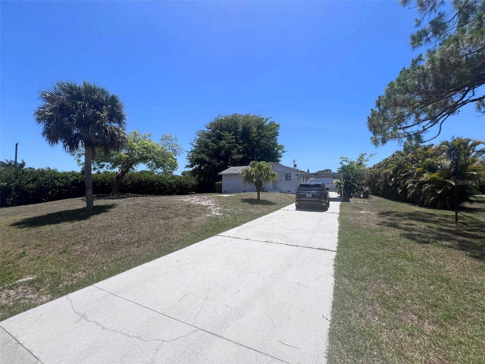 3/2, Large corner lot in great Naples neighborhood. Home needs some TLC to bring it back to life or build new!