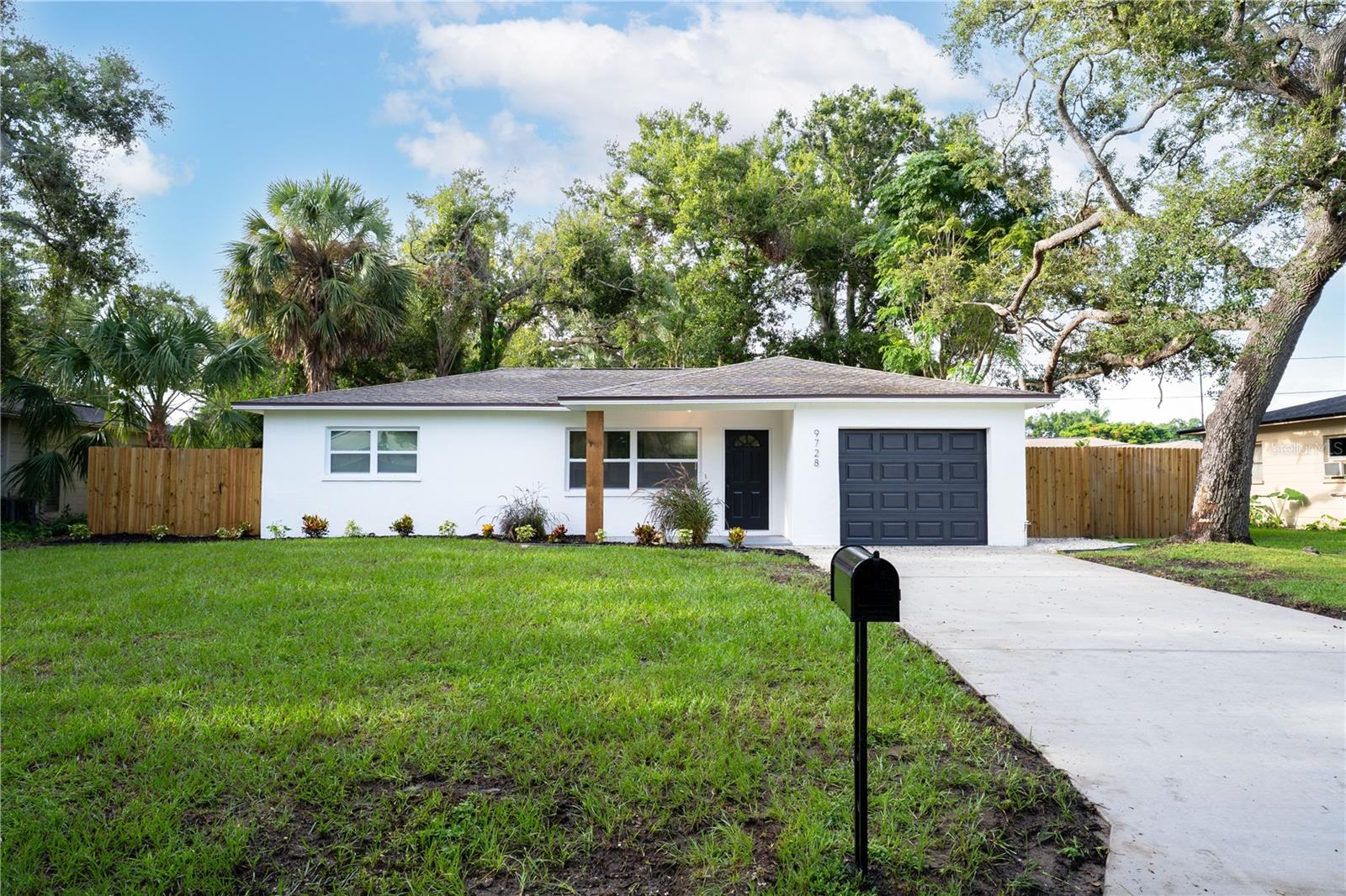 Located in the heart of St. Petersburg, this beautifully updated 3-bedroom, 2-bathroom single-family home with a 1-car garage offers modern style and comfort throughout. Recent upgrades include new LVP flooring, fresh interior and exterior paint, updated lighting, and new fixtures. The open-concept living room, kitchen, and dining area create a bright and welcoming space, highlighted by a brand-new kitchen with stone countertops, stainless steel appliances, and a large island. The modern primary suite features an en-suite bath with a walk-in shower, while the guest bath has also been stylishly updated. An oversized lanai overlooks the fenced backyard, perfect for outdoor relaxation or entertaining. Centrally located near parks, downtown St. Pete, beaches, shopping, dining, and entertainment, and situated in a non-flood zone, this move-in ready home has it all—schedule your showing today!