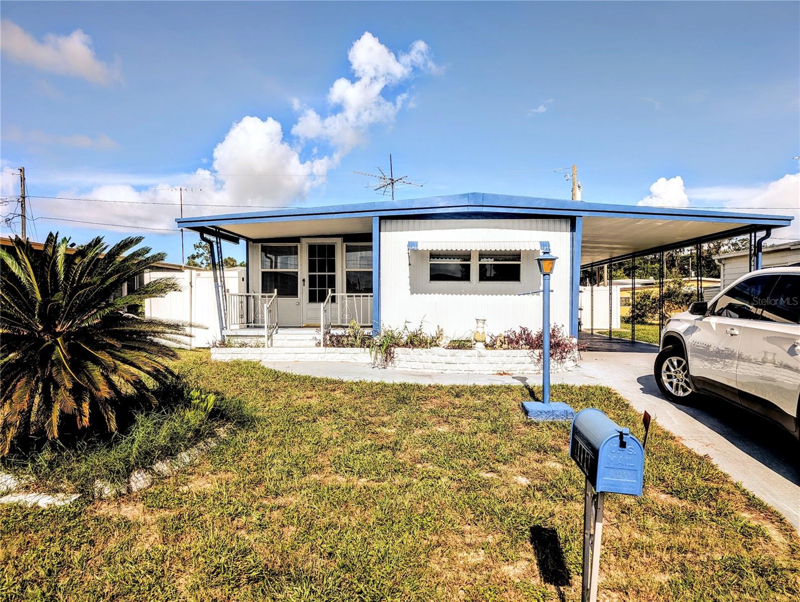 Perfect home in 55 and up neighborhood. Fully Furnished 2 bedroom, 1/12 bath with bonus room. This home is available for a yearly lease or owner will do a 6 month short term lease for an additional rental fee. Fenced yard and one small dog is permitted, Large carport that can park 2 cars. Conveniently located in Citrus Mountain MHP a 55 plus living neighborhood. The neighbors are quiet and you will be close to shopping, resturants, Downtown New Port Richey, Hospitals, Beaches and much more.