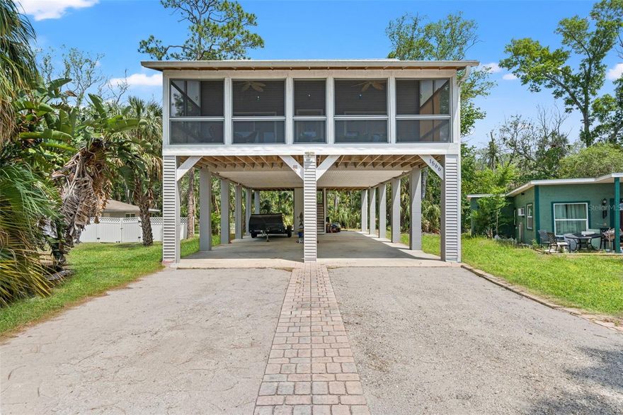 Welcome to your laid-back coastal retreat in the desirable Indian Bay neighborhood of Hernando County. This elevated two-bedroom, one-and-a-half-bath home captures the essence of Gulf-side living with inviting spaces and breezy waterfront charm. Step inside to a light-filled family room that flows effortlessly into a spacious kitchen designed for both function and style. Featuring abundant cabinetry, granite countertops, and a cozy eat-in area, the kitchen overlooks the Gulf—creating the perfect backdrop for morning coffee or evening meals. Both the kitchen and family room offer sliding glass doors that open to a covered, screened front deck where you can unwind and take in stunning sunset views over the water. The home offers two generously sized bedrooms, each with pocket sliding doors, ample closet space, and private sliding glass doors leading to an expansive 31-foot covered back patio overlooking a peaceful, wooded backyard—ideal for relaxing or entertaining in a more secluded setting. Need extra space? A charming spiral staircase in the family room leads to a 31’ x 12’ loft, currently utilized as a third bedroom, offering flexibility for guests, a home office, or creative space. Underneath the home, you’ll find an impressive 60’ x 31’ area with 11-foot ceiling height and a convenient half bath—perfect for storing boats, RVs, or all your coastal lifestyle toys. Ideally located just minutes from Hernando Beach shopping, dining, and local marinas, this home offers the perfect blend of comfort, functionality, and relaxed coastal living. Whether you’re looking for a full-time residence or a weekend getaway, this Gulf-view gem is ready to welcome you home.