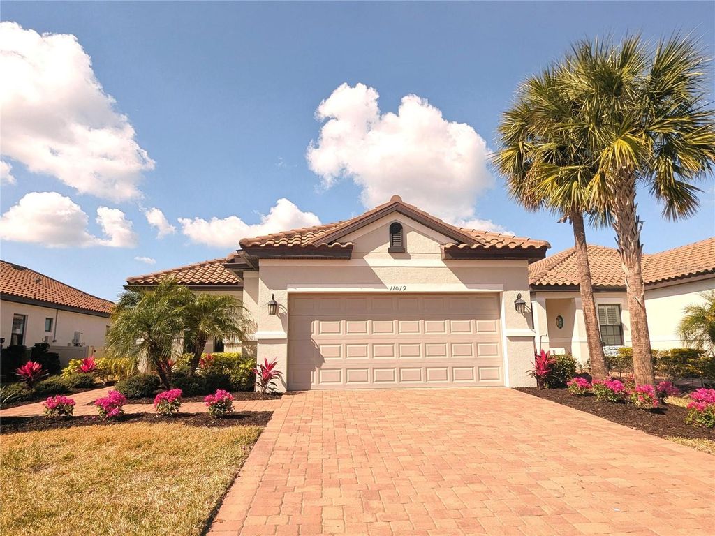 Photo of 11019 Devonbridge Drive, Palmetto, FL 34221 (MLS # O6382750)