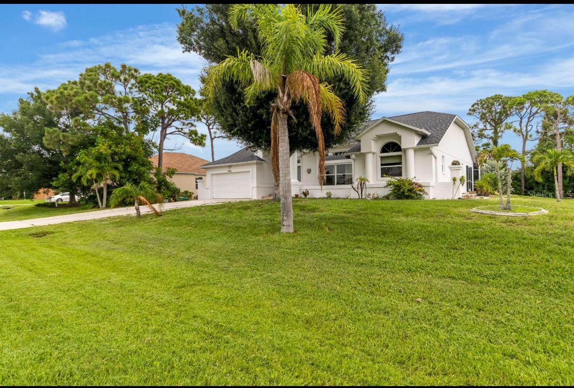 Live the Florida beach lifestyle just 3.5 miles from Englewood Beach in this true four-bedroom, three-bathroom pool home located in the highly desirable Bay Harbor Estates neighborhood. This spacious home offers two master suites and a split-bedroom floor plan with vaulted ceilings, tile and hardwood floors throughout, and a formal living and dining room, plus a separate family room for relaxed entertaining. The updated kitchen features granite-tiled countertops and backsplash, stainless steel appliances, modern cabinet doors, a closet pantry, and a breakfast nook that overlooks the screened-in lanai and private pool. Sliding glass doors from both the dining area and primary suite open directly to the pool, where a full guest bathroom also provides convenient access from the lanai. All bedrooms include walk-in closets, offering ample storage. Additional highlights include an indoor utility room off the attached two-car garage, a 2023 roof, and mature tropical landscaping. This home is located just minutes from Gulf beaches, restaurants, shops, and the 120+ acre Oyster Creek Regional Park and nature preserve, offering hiking, canoeing, and wildlife viewing. Available for purchase or for annual lease at $3,250/month with possible lease-to-own option. Don’t miss this opportunity to enjoy coastal living in one of Southwest Florida’s most sought-after communities.