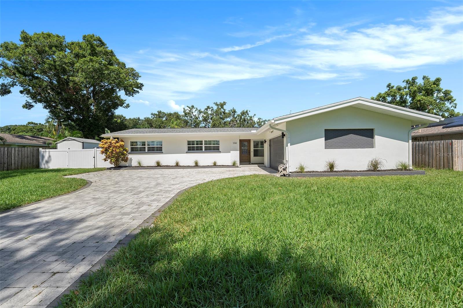 No HOA, No Flood Zone! This beautifully renovated 4 bed, 3 bath block home in central Clearwater offers over 1,800 sqft of stylish living space with a split floor plan and modern updates throughout. Enjoy a spacious kitchen with granite countertops, soft-close cabinets, and stainless appliances. The private primary suite features a walk-in closet and fully updated bath. Featuring a newer roof, newer HVAC, fresh paint, updated flooring, and a large fenced yard—this move-in ready gem is a must-see!