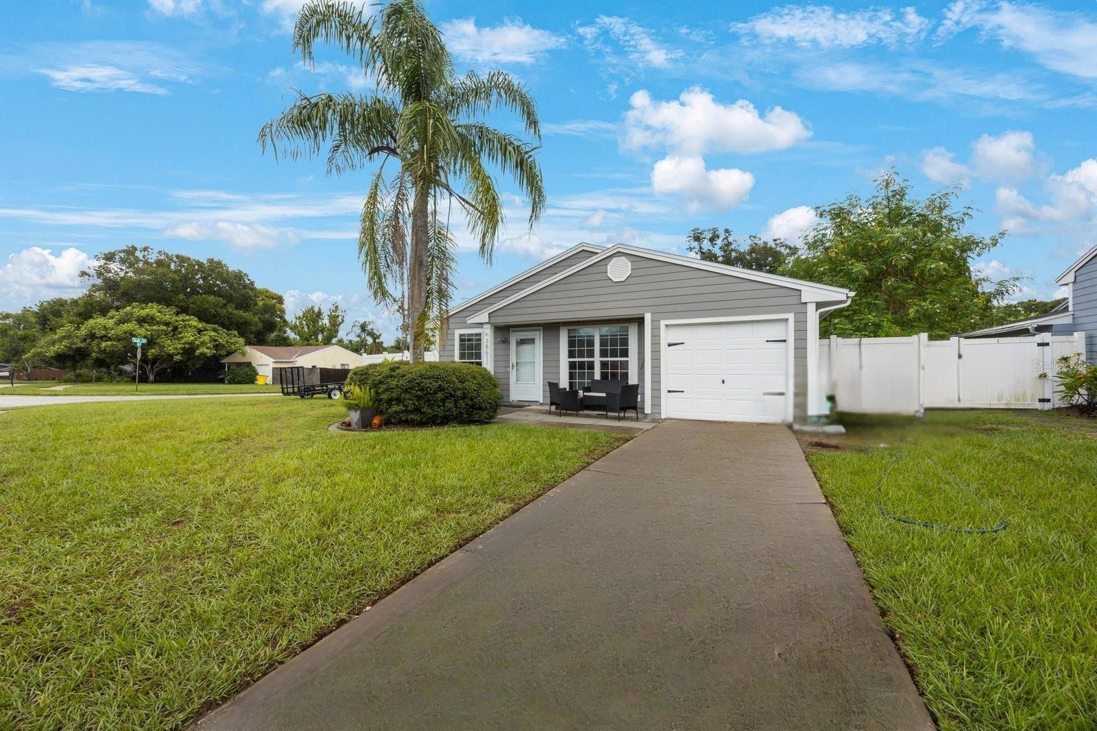 Beautifully updated 3/2 home in the conveniently located and popular community of Lake St. George! Step through the front door and you will fall in love with the updated kitchen with 42” white shaker cabinets, custom epoxy floors, newer windows and open floorplan with vaulted ceilings and tons of natural light. In addition to the amazing layout, the kitchen has granite countertops, stainless steel appliances, under cabinet and recessed lighting. You will appreciate the breakfast bar with new pendant lighting that opens up to the great room making this an excellent home for entertaining and gathering together to make wonderful memories. The Primary Bedroom features an en-suite bathroom and a double closet. All bedrooms are spacious with plenty of storage space and the 3rd bedroom features a newer sliding glass door to back yard, making it great for an office or playroom! Enjoy outside entertaining on this large corner lot and quiet street! There is plenty of room to create a backyard oasis and possibly add a pool. There is a newer white vinyl privacy fence giving you a perfect space for parties, pets, grilling or chilling! The Roof and A/C were replaced in 2022. This home is in a non-evacuation zone and does not require flood insurance. Travel about 3 blocks to the Lake St. George Community recreation area that has a lakefront park, picnic tables, fishing pier, community pool, playground, tennis and basketball courts. Other local attractions include East Lake Woodlands Country Club, Lake Tarpon, Brooker Creek Preserve, great restaurants and it’s just a short trip from here to Honeymoon and Caladesi Islands. Last but not least, the zoned elementary and middle schools are A rated and combined with the local amenities this is the perfect home for the next chapter in your book..