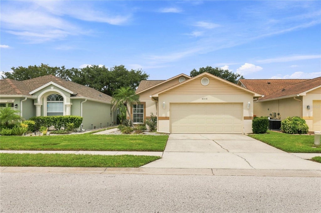 Photo of 6315 Gentle Ben Circle, Wesley Chapel, FL 33544 (MLS # TB8543095)