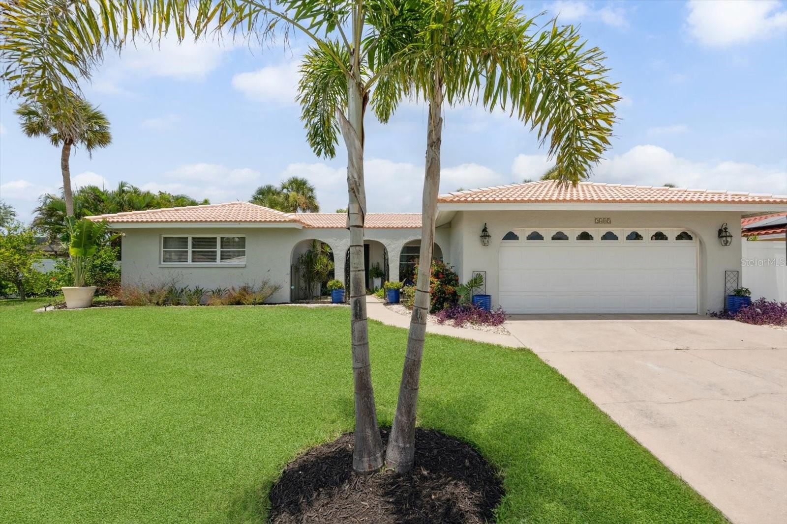 The one you've been waiting for in Gulf Gate Woods! Come check out this beautifully renovated home, sitting on one of the best lots, with private water/nature views, and just minutes from Siesta Key! This block home stands strong and dry, yet less than 2 miles from the world famous Siesta Key! You will truly enjoy the endless stores, restaurants, shops, and entertainment nearby! This home has gone through extensive updating since 2020 including: HVAC, water heater, appliances, cabinets, marble counters, glass tile backsplash, farm-house style sink, trim, accent wall, light fixtures, luxury vinyl plank, tile, premium carpet, and sewer line!! The home sits on a premium over sized lot with beautiful lighted landscaping and lovely private water/nature views! Take in the scenery in your large heated/cooled sun room! Other great features are the long lasting tile roof, front court-yard area, and optional HOA! Room dimensions in the photos. Short term rental friendly.