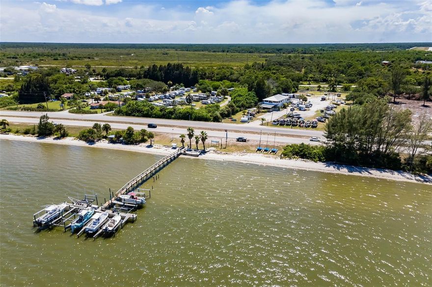 Commercial marina and marine service center located on the Intracoastal between Melbourne and Sebastian in Brevard County. This waterfront property is zoned for commercial marina and BU-1 mixed use with a submerged land lease from the state of Florida. Newly rebuilt dock and 9 boat slips with 10k lifts outfitted for 25' to 32' boats. A 210' sandy beach shoreline, a 1,700 sf restaurant/bar plus office spaces, a CAT 3 aluminum 45x35x13' open workshop, and a 10k fixed yard lift accommodates 15' high semi-trucks to unload boats with a clear turnaround. Gated entry and fencing surround the property. The property includes a private residence of 1,867sf, 3/2 with a large balcony overlooking the Intracoastal waterway and an inground pool. Owner financing options are available. Make your appointment today!