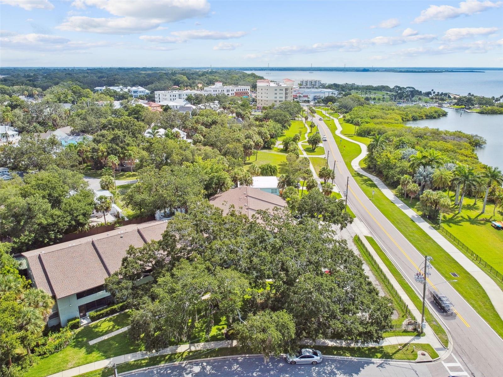 Available May 1st 2025 for 4 month minimum rentals. Harbor Lovin' abounds in this waterfront Safety Harbor gem! Wake up to bayfront sunrises right outside your bedroom window. People and dolphin watch with your cup of coffee on the enclosed sun porch. Launch your kayak right across the street to get better views of the rays and manatee. Hungry? Walk two blocks and get your fill on seafood, Mexican, BBQ, ice-cream, coffee, you name it and Main Street has it. Festivals, Sunday Market, 3rd Friday, library events -it's all within walking distance. You literally never need to move your car from its covered carport spot! Golf carts are also welcomed and available for rent. Inside you have all the comforts of home in this fully renovated and fully furnished jewel. Offering sweeping views of Old Tampa Bay from almost every room, this first floor condo offers ample living space for when you are not living outside. A split floor plan includes a large waterfront primary bedroom with enormous walk-in closet and updated primary bath with even more closet space. A second bedroom includes two twin beds or one king bed and plenty of closet space. Finally feel like cooking?! The fun and fabulous kitchen comes fully stocked with everything you need to cook up a delicious meal. Everything is new- appliances, countertops, lighting fixtures. An expansive kitchen bar seats 3 comfortably and the dining table seats 6. One covered parking space and open guest parking are located right out front. Bikes and kayaks are also included in the rent or bring your own. The bike rack and kayak rack are always open! Conveniently located to all major sport arenas, our world-famous beaches, downtown Tampa and St. Pete and only 15 minutes from TPA, whatever you are looking for is right outside the front door. Pack those bags, and come experience firsthand the quaint city of Safety Harbor and Harbor Lovin' at its finest. 4 month minimums required. Condo is rented from Dec 2025-May 3rd, 2026
