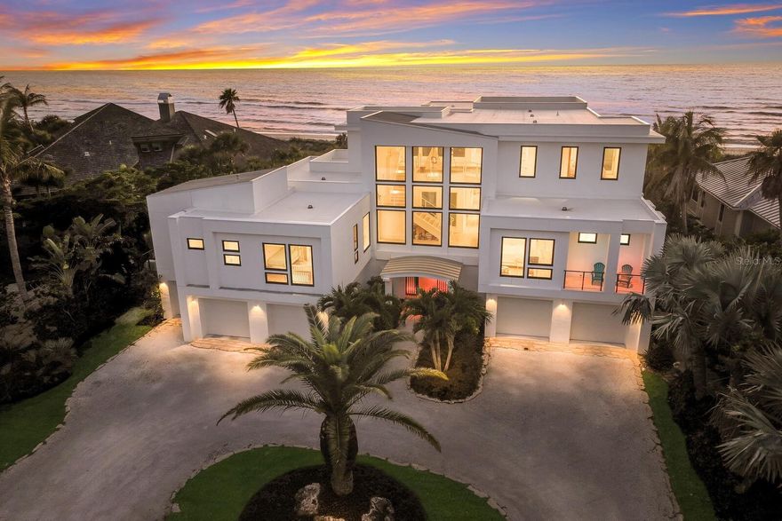 This impressive beachfront estate, situated on over an acre, offers magnificent, panoramic views of the Gulf of Mexico. The main living space is well designed, and light filled with high ceilings and glass doors that open to a covered poolside patio. The kitchen and butler's pantry are equipped with custom cabinetry, high quality appliances, including Thermador, Sub-Zero, and Bosch, complemented by soapstone counters and wood inlay ceilings. With 2 living areas, top floor loft and 8 bedrooms, this 3-story home provides ample living space for family and friends. Outdoor amenities include the coral stone patio encompassing the heated, infinity-edge pool with lap lane, spa and a fire pit, all with gulf views. Oversized decks provide additional outdoor living space and lead to the beach walkway. Designed with impact resistance windows and doors, this family home has 5 garage spaces, a dedicated golf cart garage and a large, air-conditioned storage room. The exterior construction is comprised of steel beams with wood infill, poured concrete and steel columns. Never miss a sunset in this custom Dewey-Noller Builders beachfront residence.  

Discover the allure of Boca Grande with its tranquil beaches, world class fishing, iconic village and landmarks such the historic Gasparilla Inn and Club. Immerse yourself in the rich history and luxurious ambiance that define this captivating island retreat. Coral Creek Airport and the Boca Grande Jet Center are just 2 miles from the island. For golf enthusiasts, nearby Coral Creek Club, is recognized as one of the nation's premier, private golf clubs.