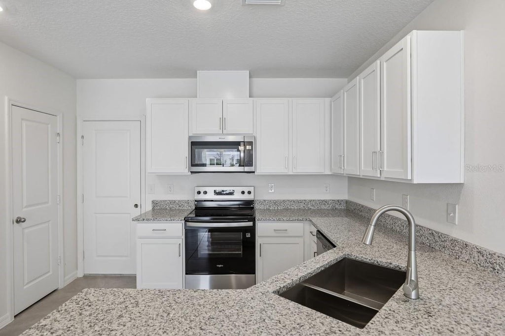 Photo of 631 Meadows Edge Place, Lake Wales, FL 33859 (MLS # O6443300)