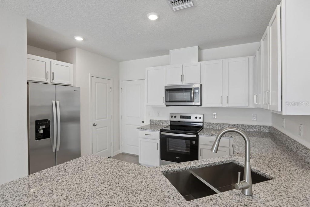 Photo of 631 Meadows Edge Place, Lake Wales, FL 33859 (MLS # O6443300)