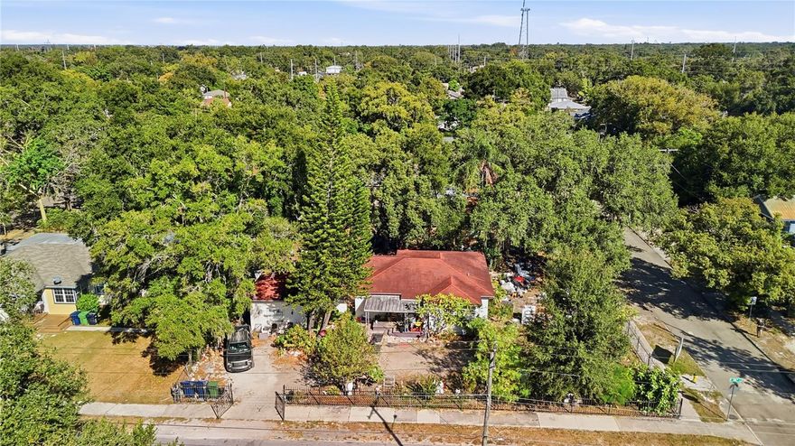 Discover incredible potential with this oversized .27-acre corner lot located in up and coming Ybor. Fully fenced with a gated entrance, the property features a 3-bedroom, 2-bath home and a separate one-car garage, offering a rare chance for a full renovation project or a complete tear-down to build one or more new homes. Boasting generous 103 x 114 dimensions, this lot provides ample space for creative development—ideal for investors, builders, or homeowners looking to design a custom residence in a rapidly growing area. Situated just 10 minutes from Downtown Tampa, 15 minutes to Tampa International Airport, and close to local restaurants, shops, and grocery stores, this location delivers unbeatable convenience and connectivity. Whether you envision a modern rebuild, a multi-home project, or a transformed historic gem, this property offers unmatched flexibility and opportunity in one of Tampa’s most central and revitalizing neighborhoods. Don’t miss out!